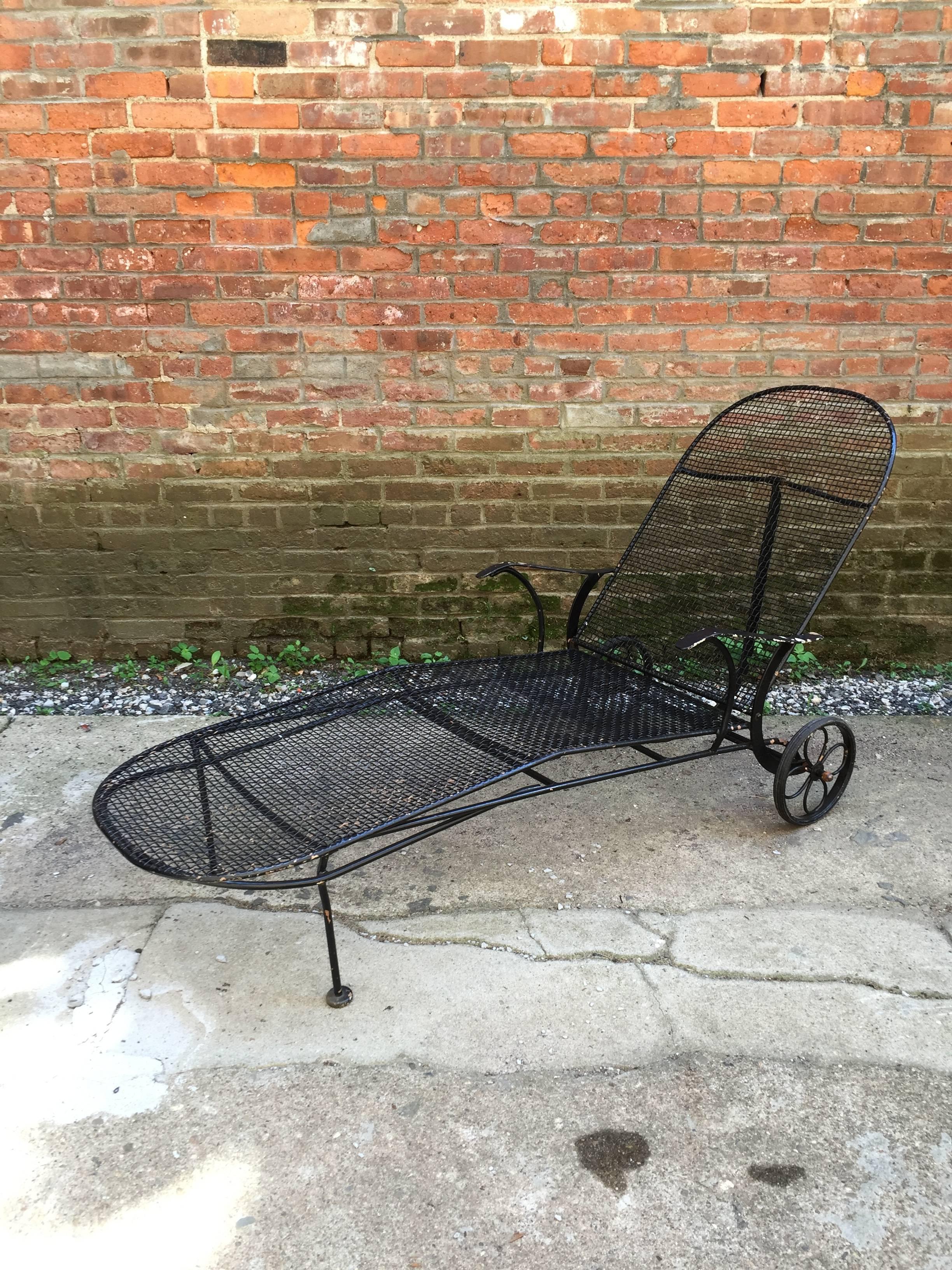 Fully adjustable and mobile wire mesh Woodard chaise longue. Patio or poolside perfection.