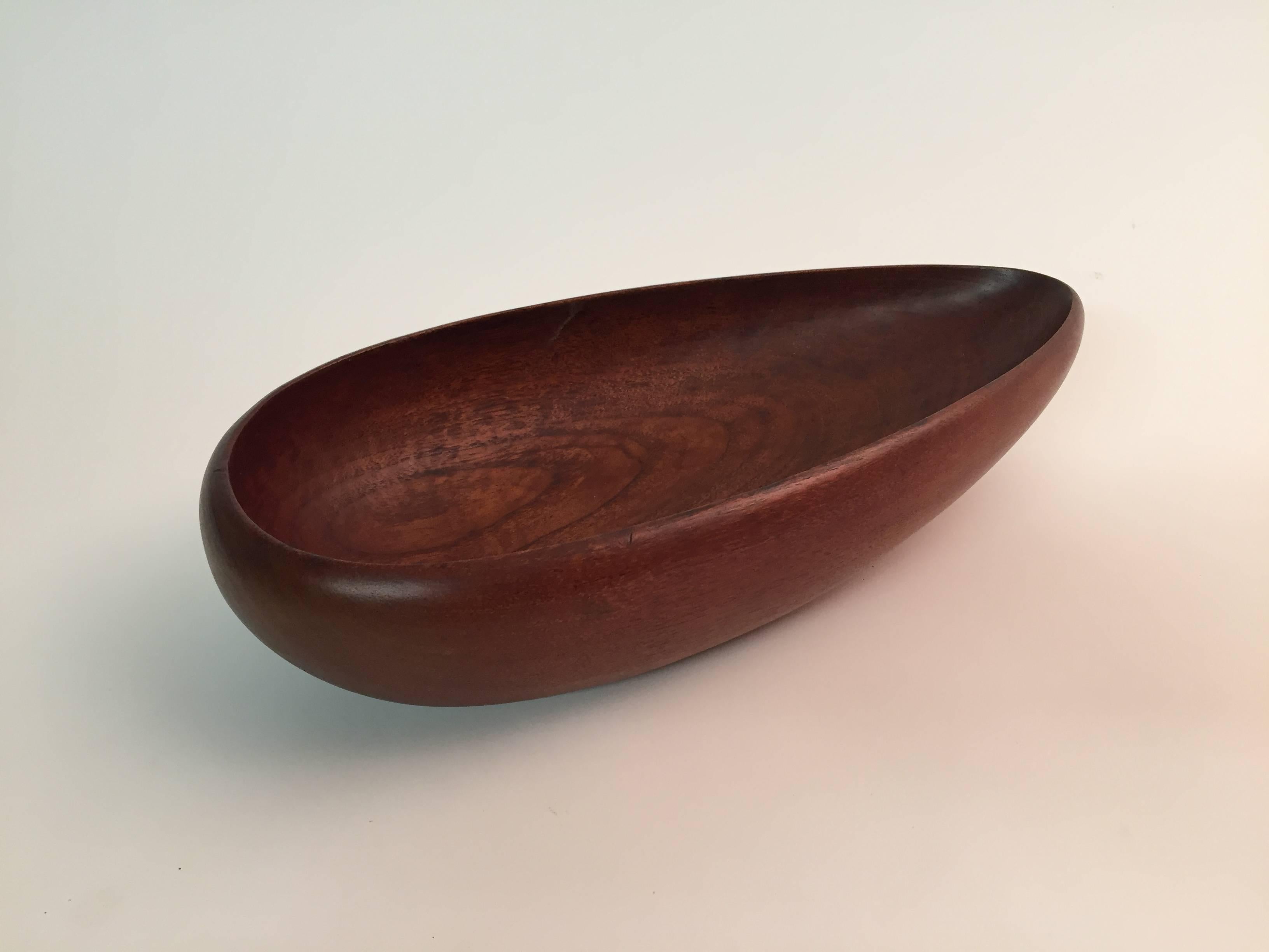Solid teak carved teardrop shaped bowl. Fully signed with paper label and impressed signature, Denmark, 25, Odense, Laur. Jensen, wooden wares.