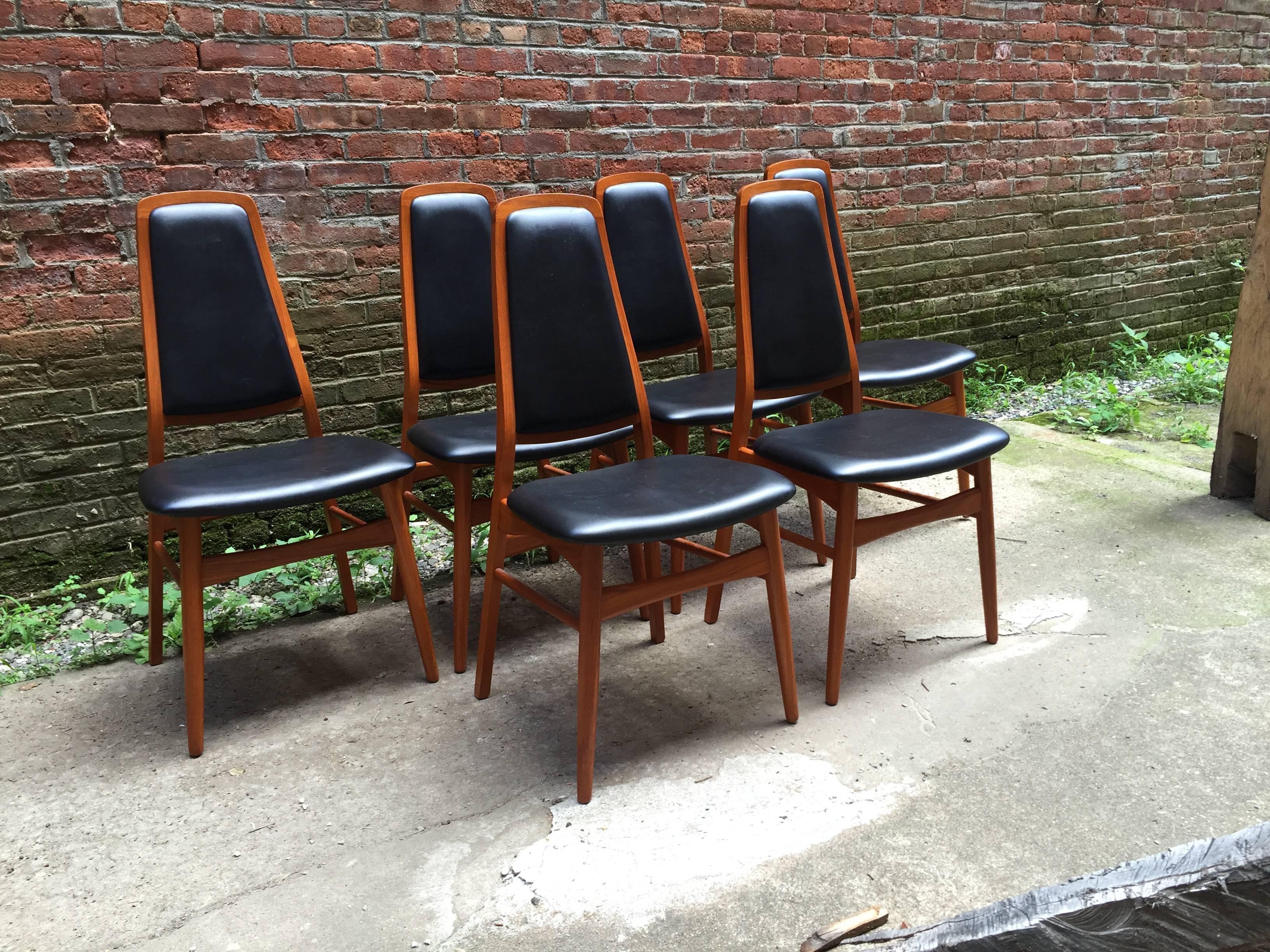 Set of six elegant Danish teak dining chairs. Teak frames and black vinyl upholstered seats and backs. Some are signed Art Furn, Made in Denmark, circa 1970. Super clean and sturdy.
