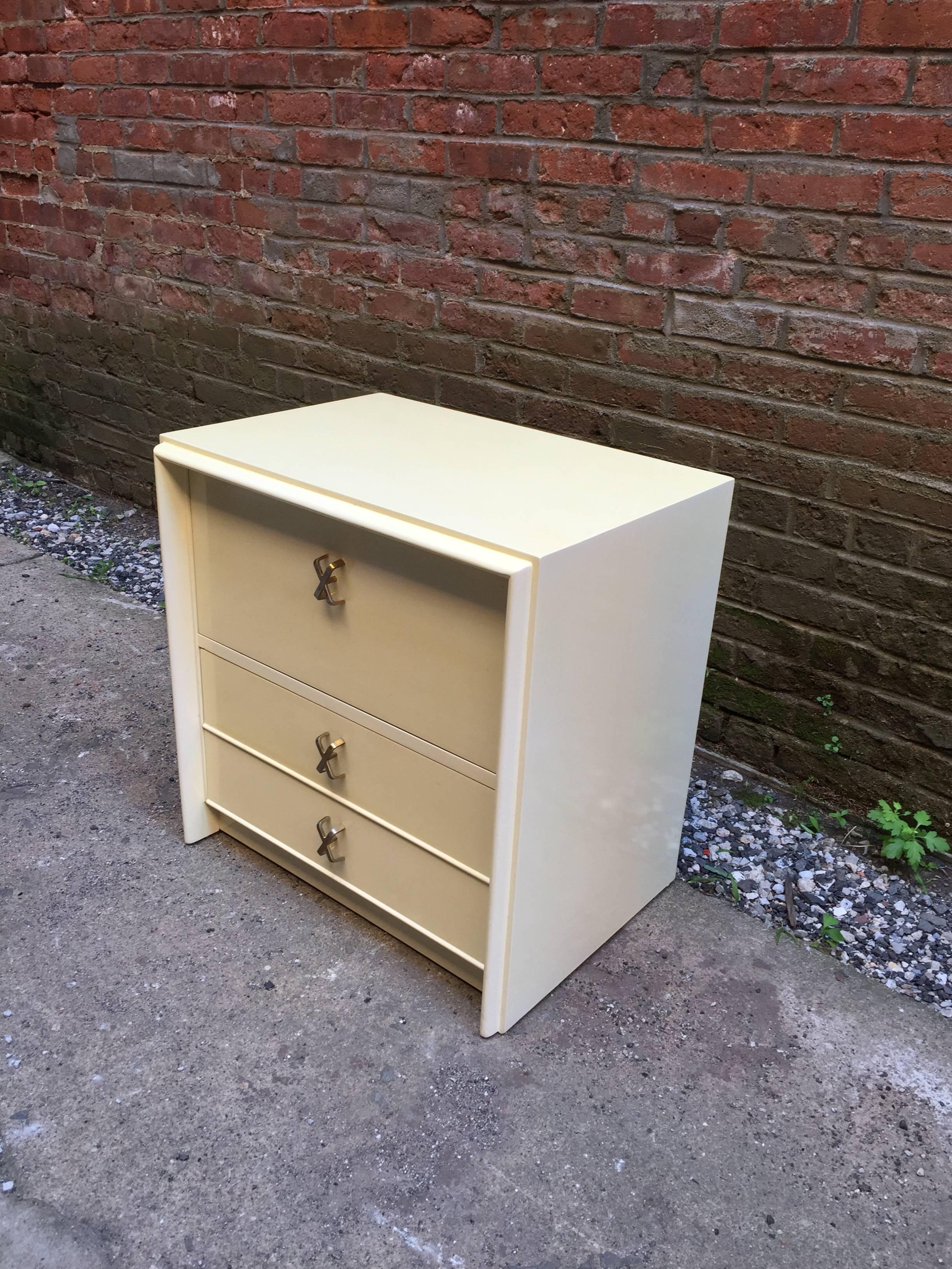 Paul Frankl designed end table for Johnson Furniture. Two drawers under a drop down front compartment. Signed with John Stuart label in top drawer.