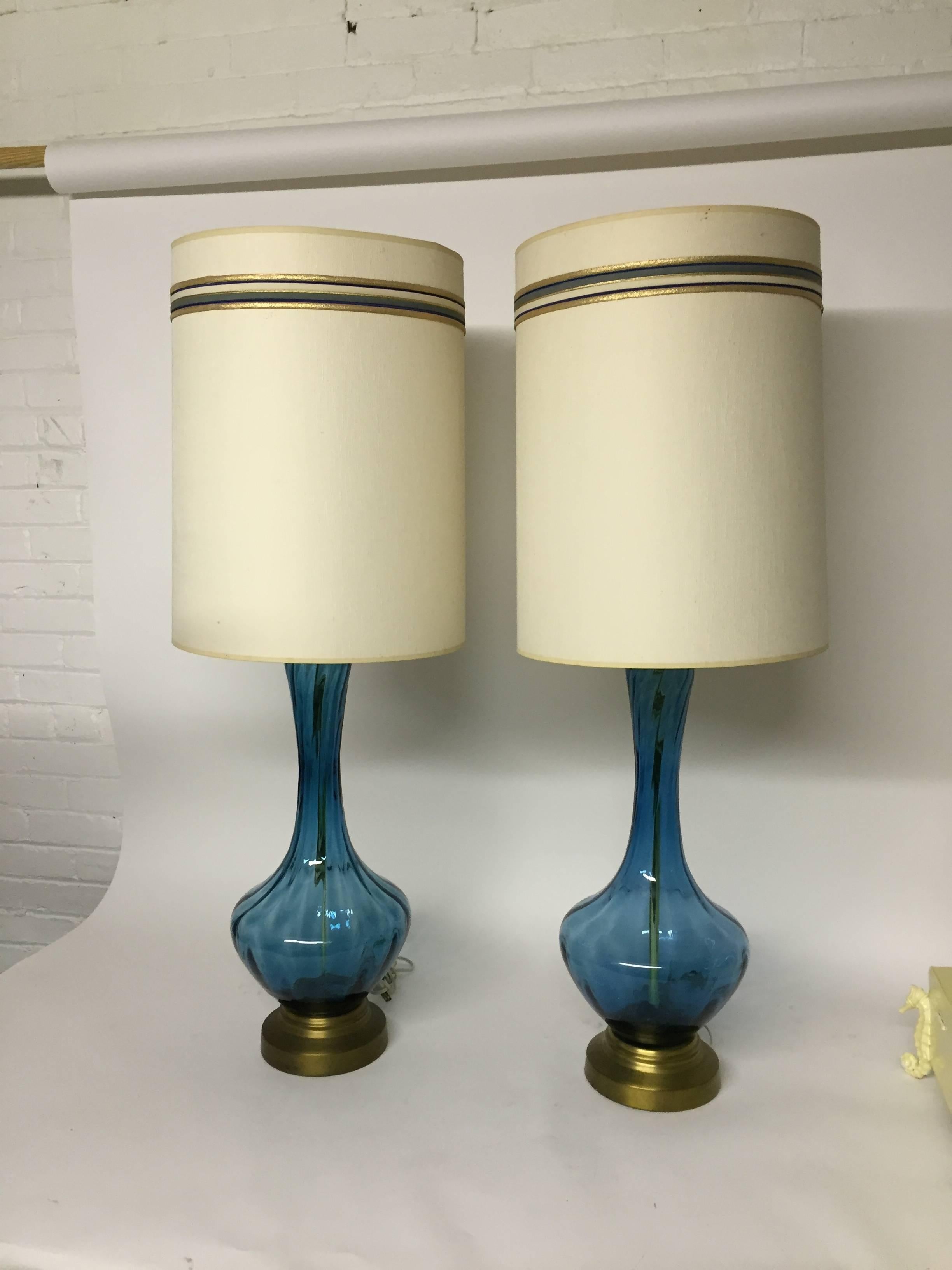 Elegant pair of blown glass table lamps. The glass body measures 19