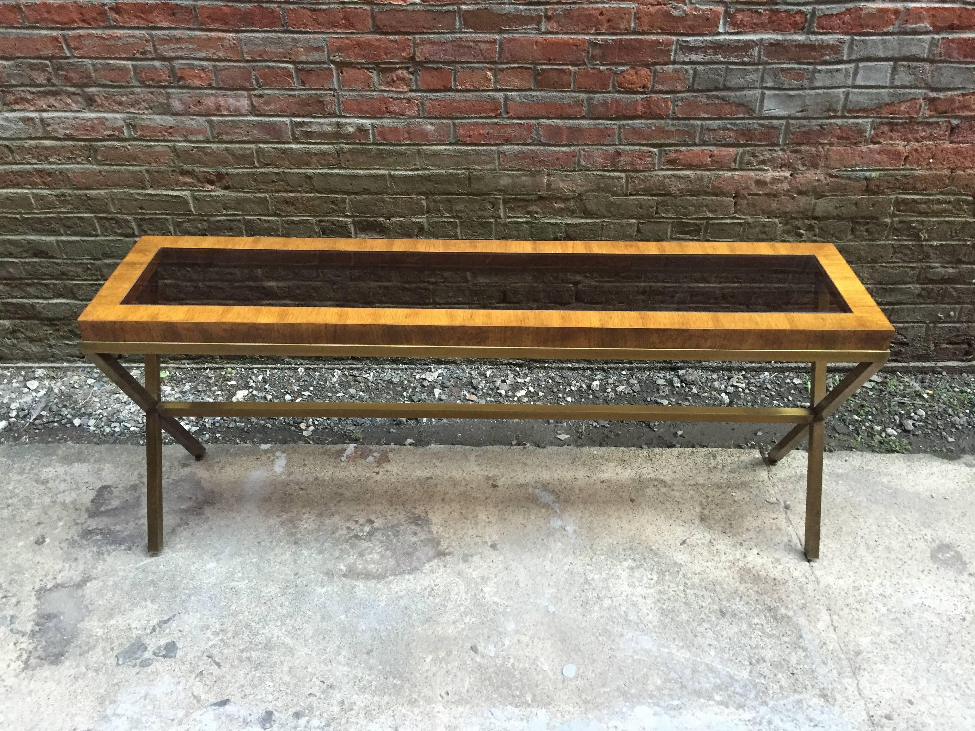 Beautiful mix of metal, wood and glass. X-shaped stretcher base table supporting a rectangular wood top with a removable smoked glass insert, circa 1970.