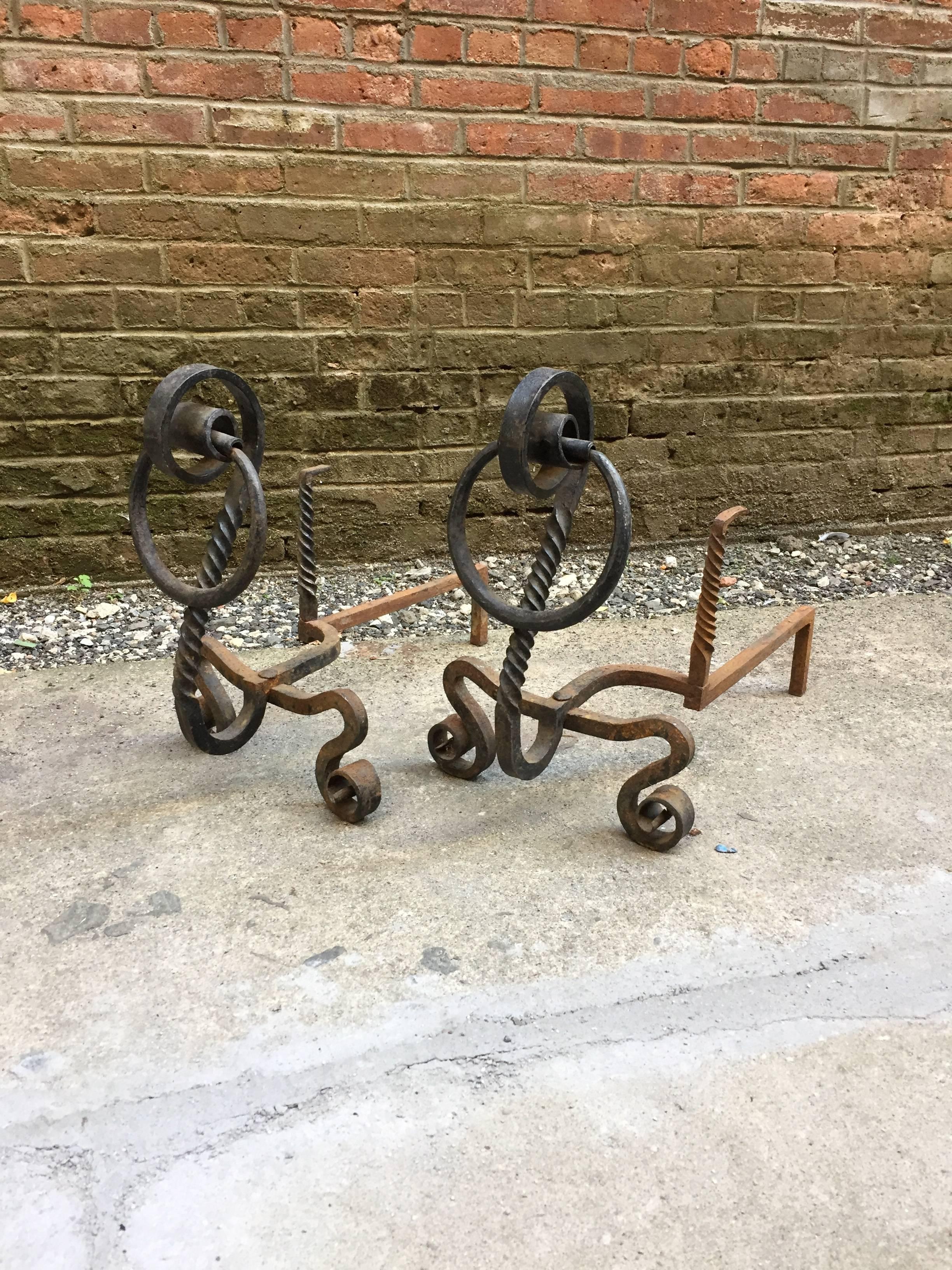 Pair of early serpentine scrolled and twisted andirons. Beautifully hand-wrought, circa 1870-1880. They could possibly earlier.