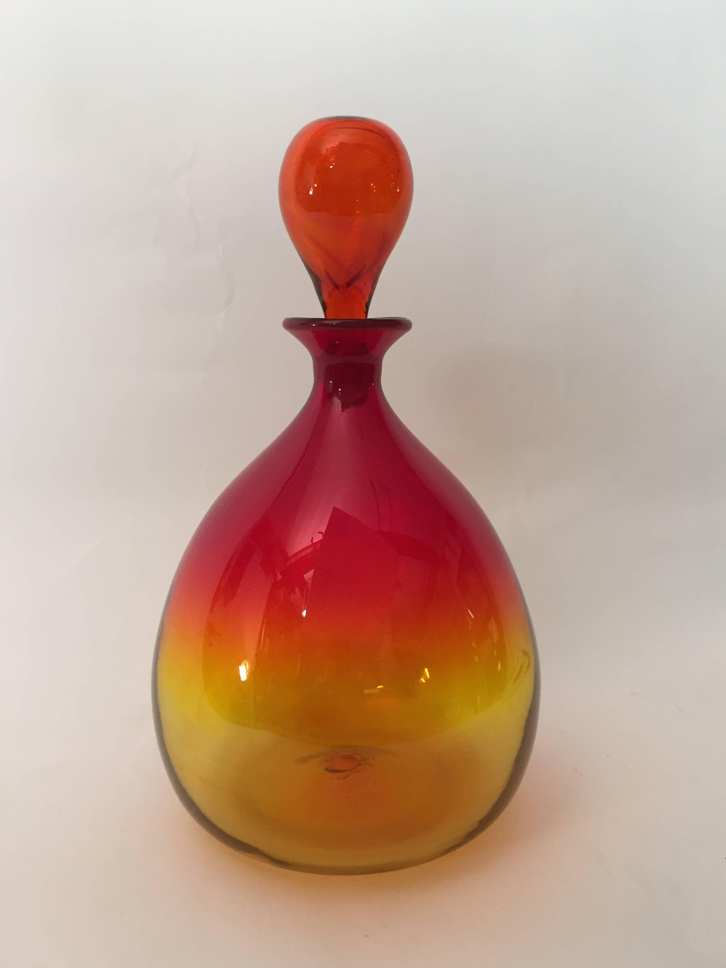 Beautifully blown bulbous amberina bottle with tear drop stopper. Wayne Husted design for Blenko, circa 1960.