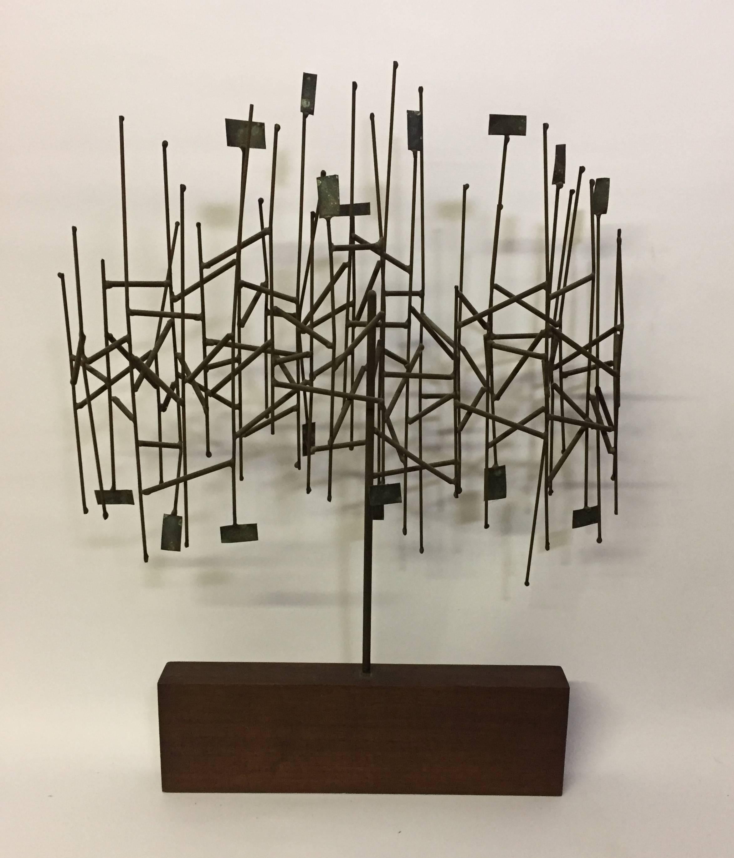 Wonderful mixed metals tree sculpture, circa 1960. Mounted on a walnut wood base. Reminiscent of Harry Bertoia's sculpture. The sculpture has been attributed to an Italian artist named Brazza who worked predominantly in the USA in the 1960s and