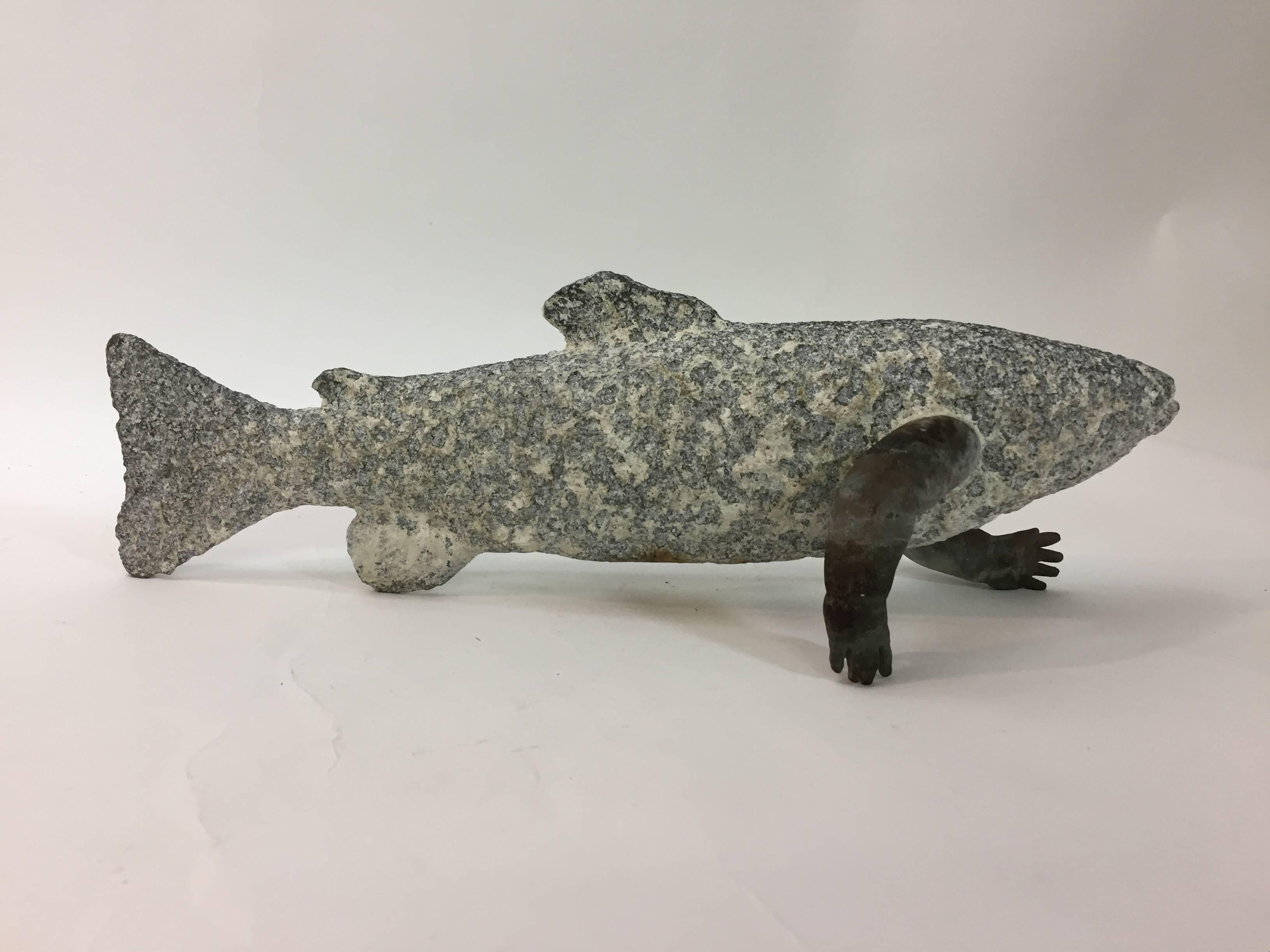 A complete oddity. This fish sculpture is signed and dated, Maxon, 1995. There are some other illegible markings on the arms of the fish. Constructed from a carved stone and what appears to be cast bronze arms.