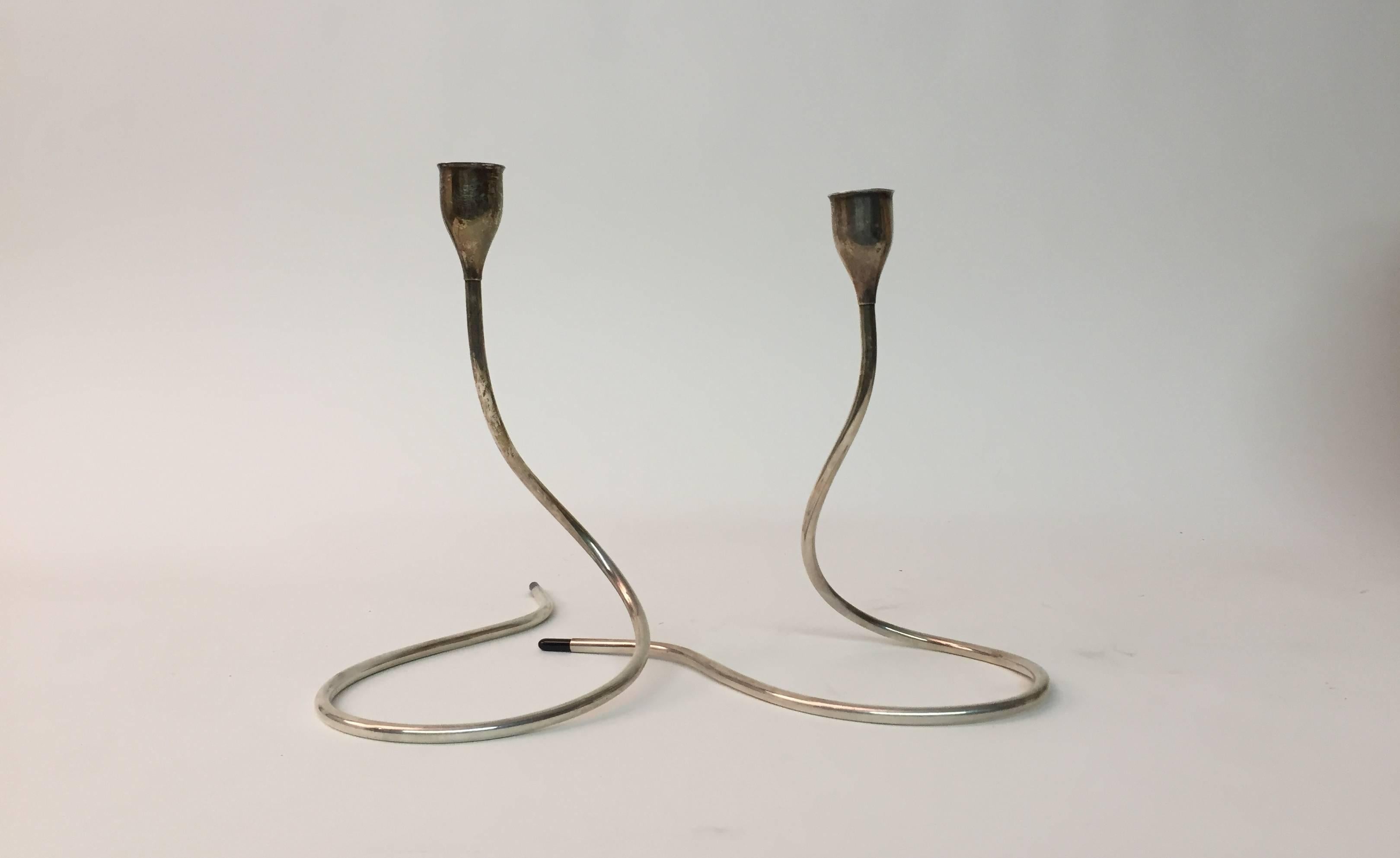 Wonderful pair of sterling silver candlesticks designed by Marion Anderson Noyes for Towle. Black plastic tipped ends. They measure individually 8.75