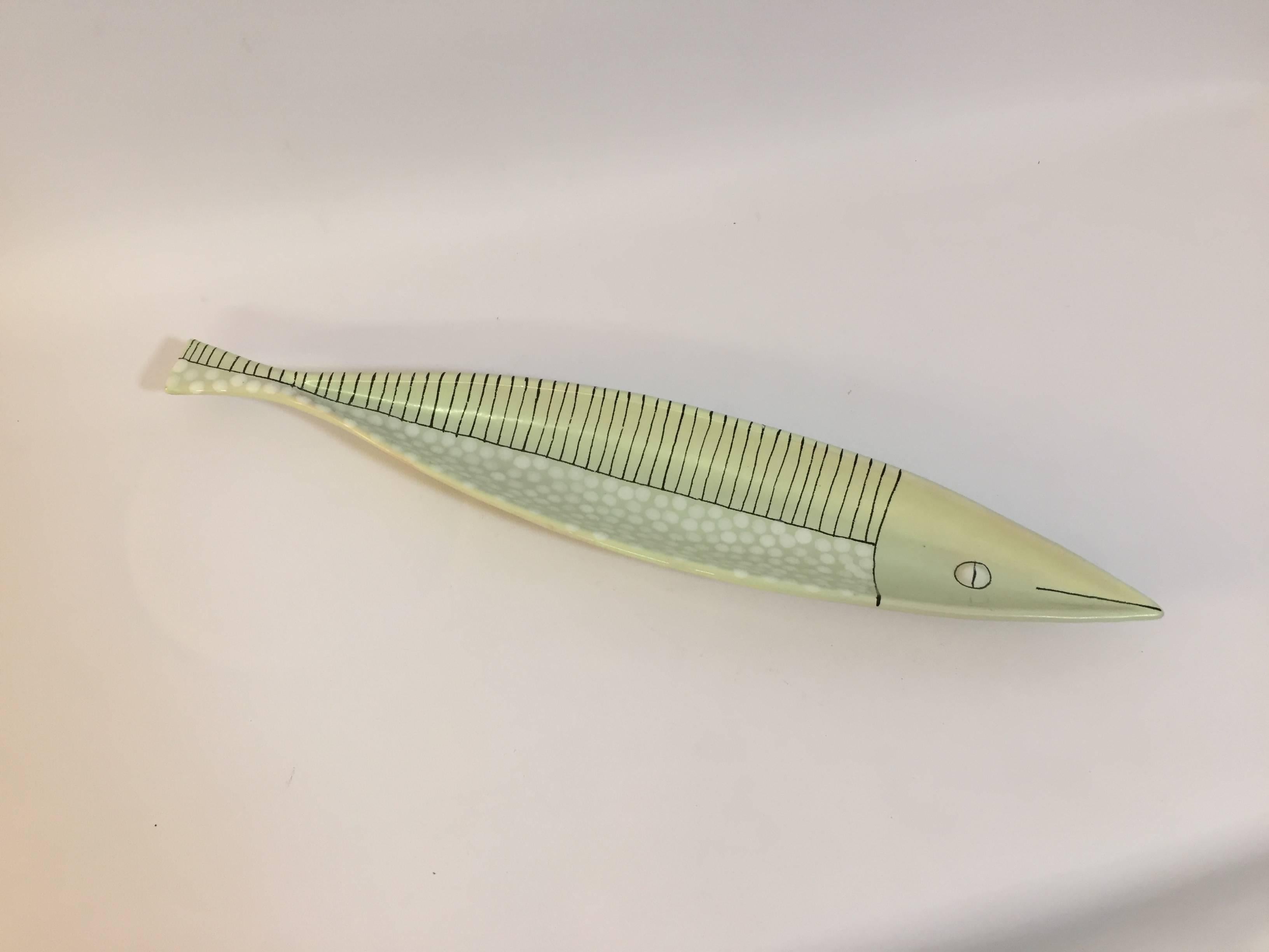 Fun and whimsical art pottery fish. Signed on bottom, B.24B, Italy. Celadon green glaze with white and black accents. Very good, original condition with some glaze misses and roughness on tip of mouth and tail fin.