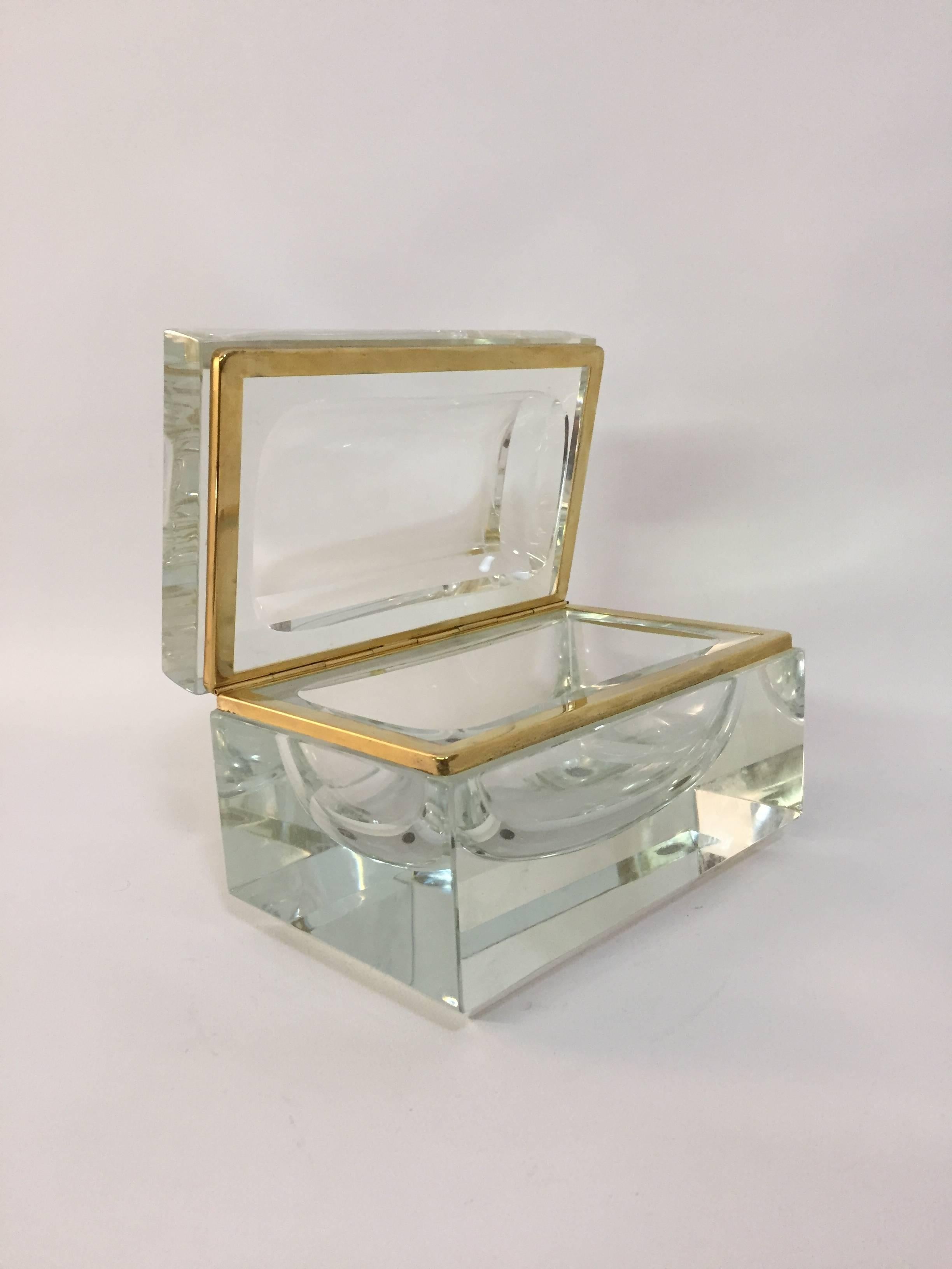 Heavy and chunky faceted glass box designed by Alessandro Mandruzzato. Wonderful concave 'scooped out' interior. Brass lip liner.