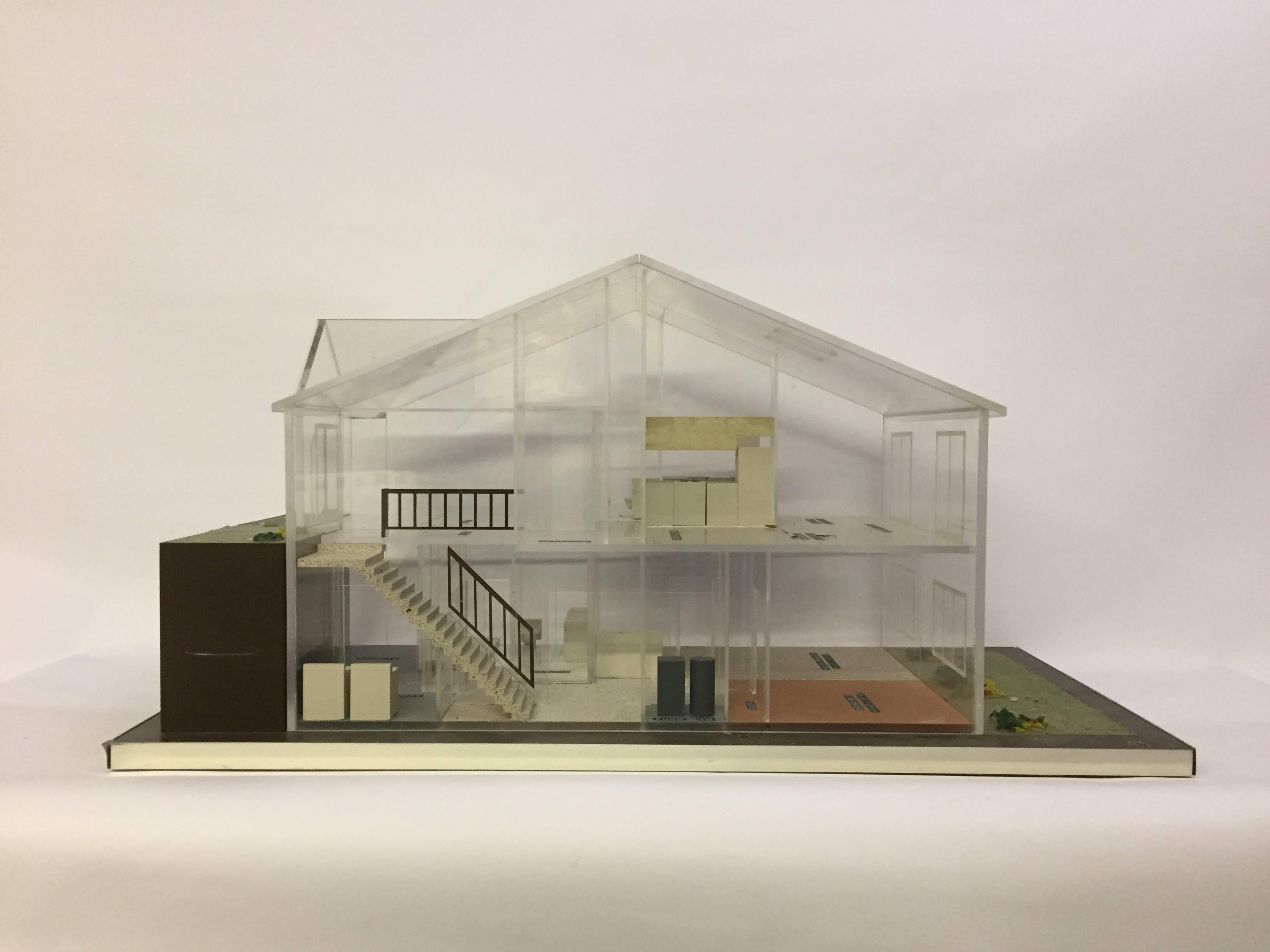 Wonderful architectural model rendering for a client's home, circa 1970. The house was never built, but the model remains. Made of clear Lucite/acrylic and with some furnishings. Cabinetry included in the bathroom, kitchen and laundry room. Each