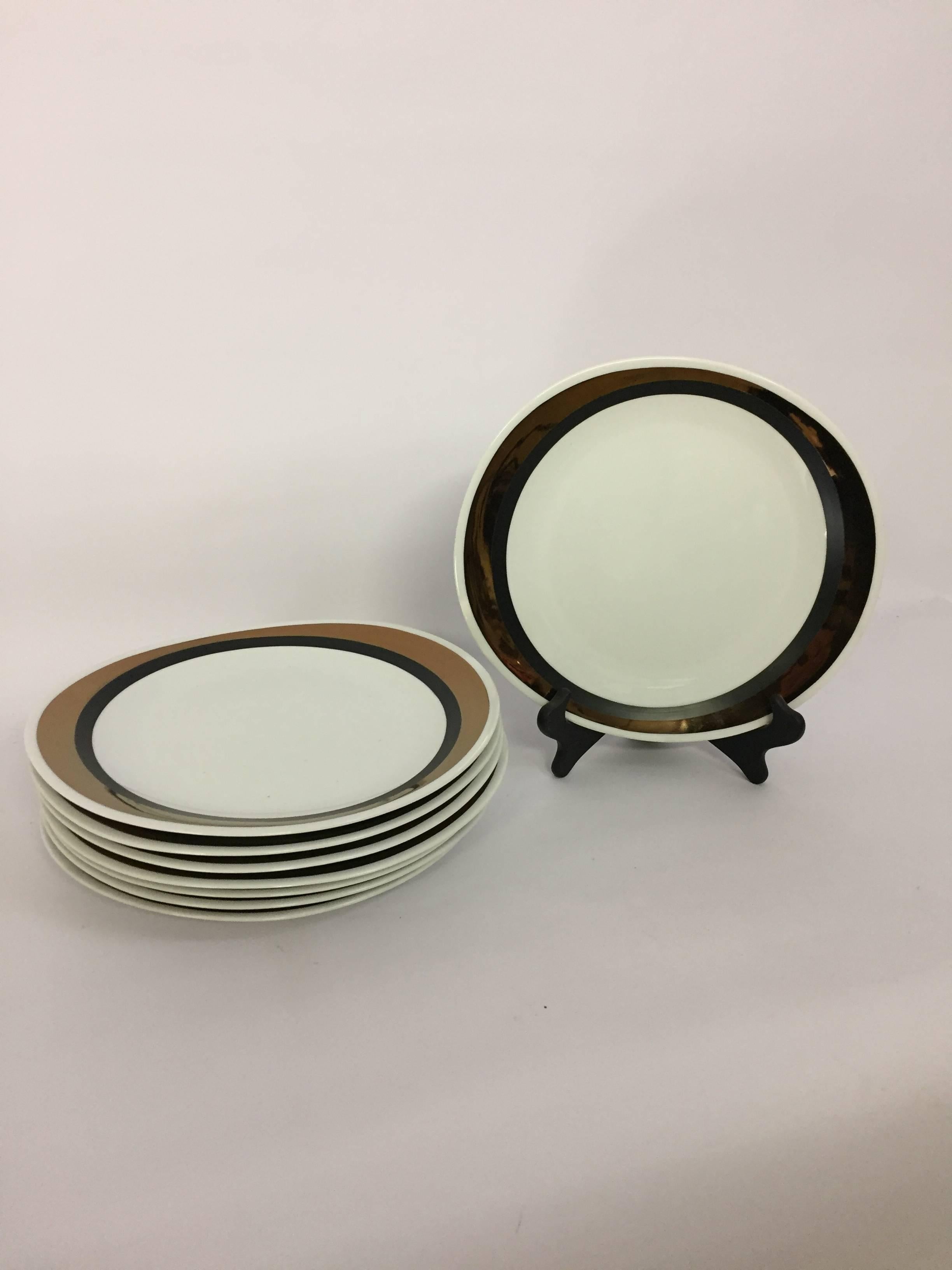 Wonderful block China Mid-Century Modern service for eight. Hand-painted black and copper lustre outer edge design. Fully signed on bottom block, Bidasoa, Spain, Creation, Horizons, hand-painted. Each plate retains its original plastic bag for