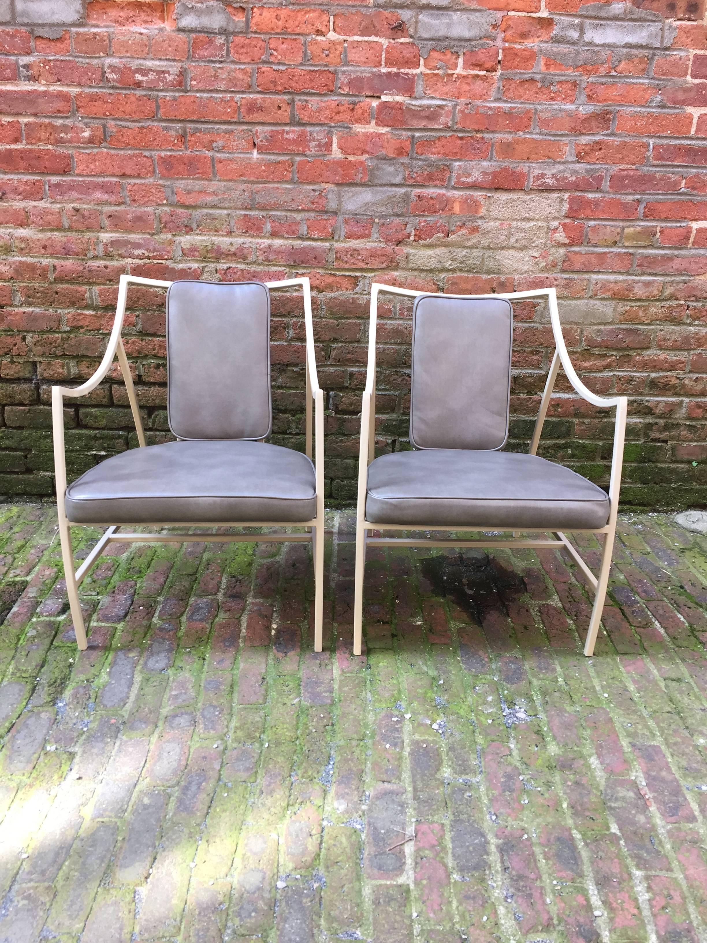 The pair can work either indoors or outdoors. Beautiful curvilinear frames with gray vinyl seats and backs. The frames are made of square tubular aluminum. The seats and back are in a gray vinyl. The Holiday line designed by Kipp Stewart and Stewart