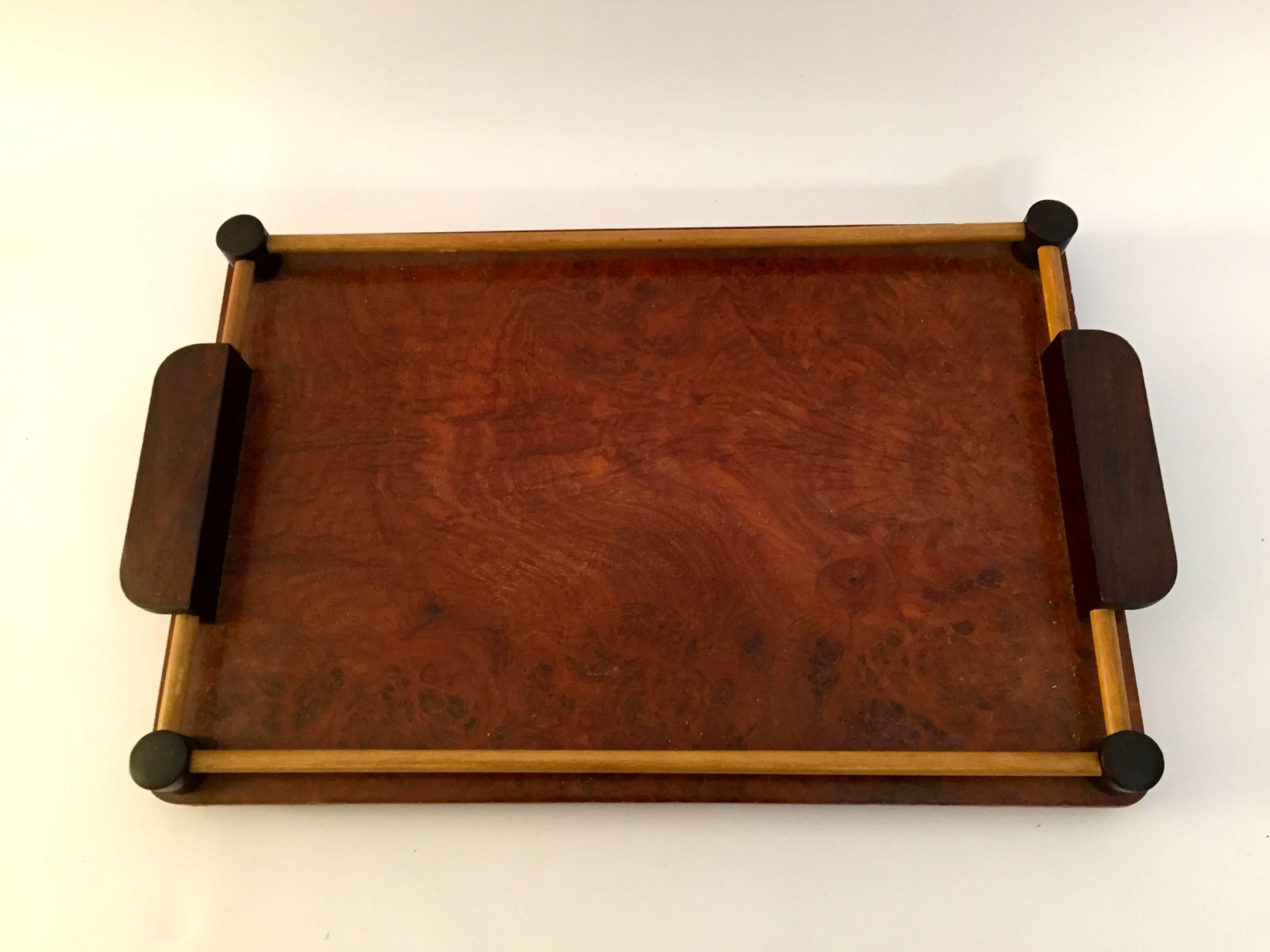 The surface is a beautiful figured walnut burl veneer and the handles and corner accents are of solid rosewood. The dowels look to be birch. Compact size that will compliment any flat surface, circa 1930-1940.

Measures: 18.38