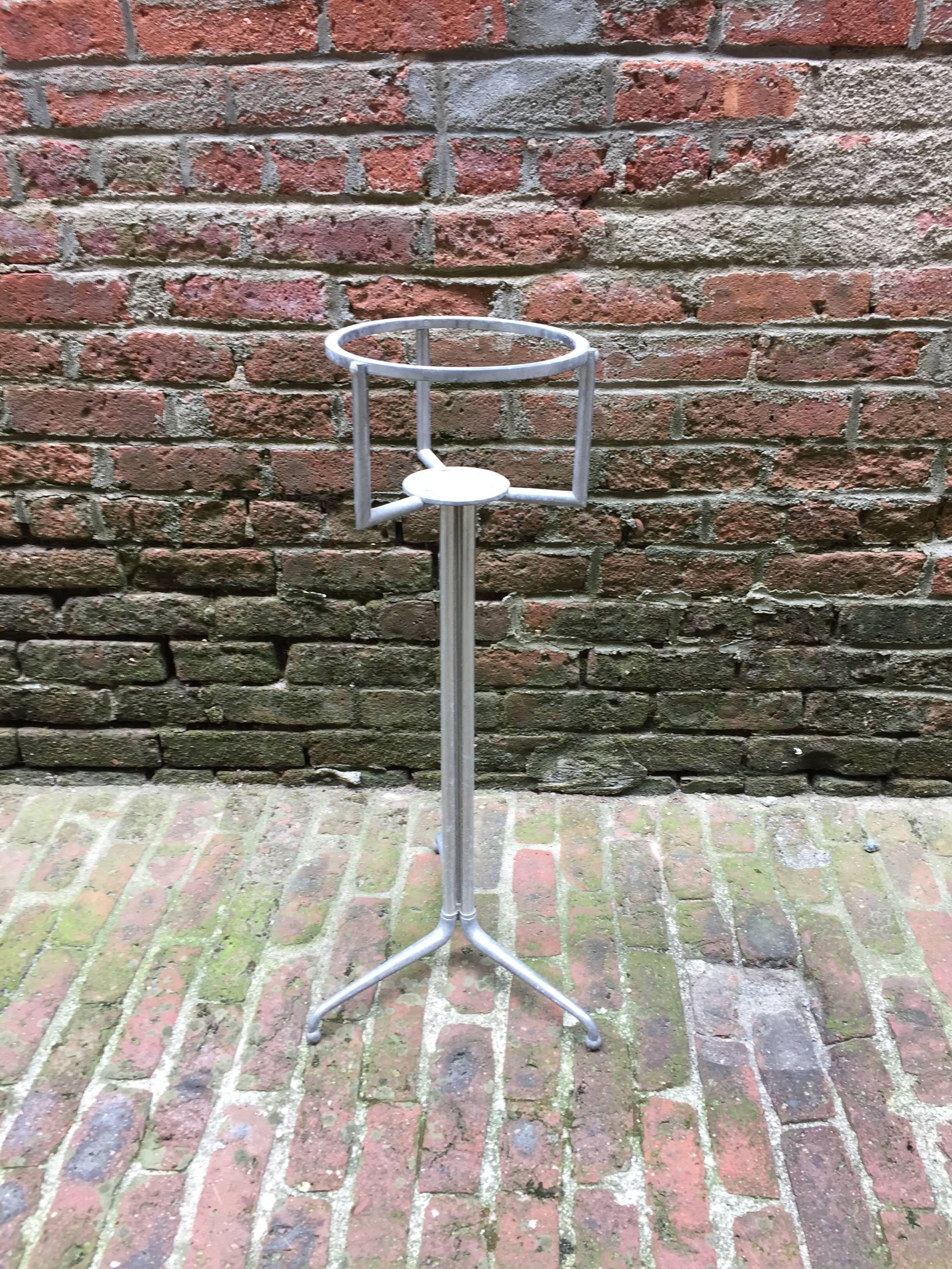 Wonderful Italian modernist design, circa 1960-1970. Tripod base ending in an elegant turned leg with ball feet. Signed with label, Made in Italy. 

Overall height is 28