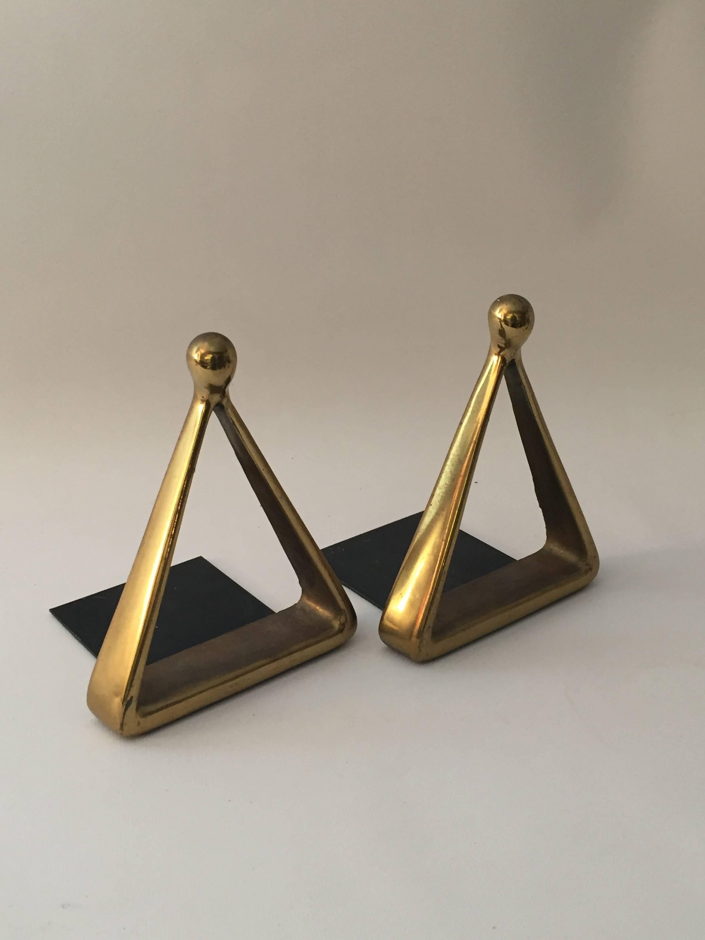 Sculptural and beautiful brass-plated bookends designed by Ben Seibel for Raymor. Signed raised Jenfred Ware mark and complete paper label on bottom. Felted bottoms.
 
