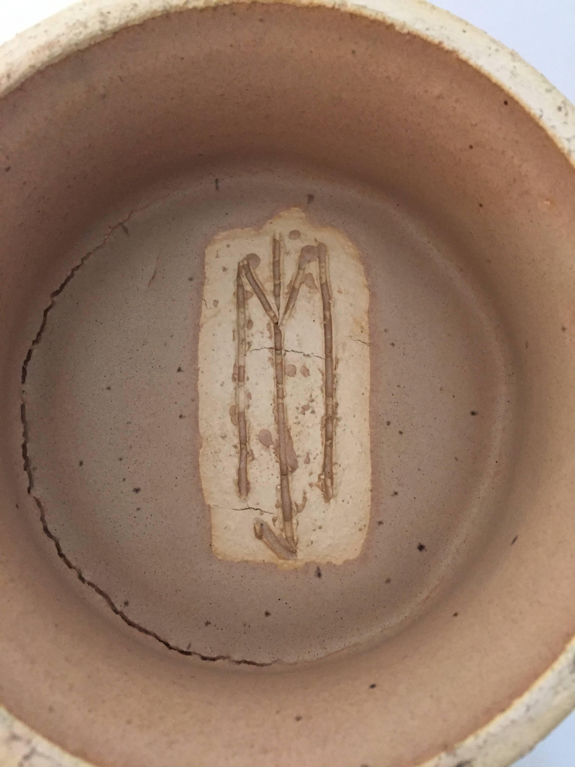 Signed John Masson lidded vessel with in the round carved wheat design. Hand thrown and fired stoneware.

14.5