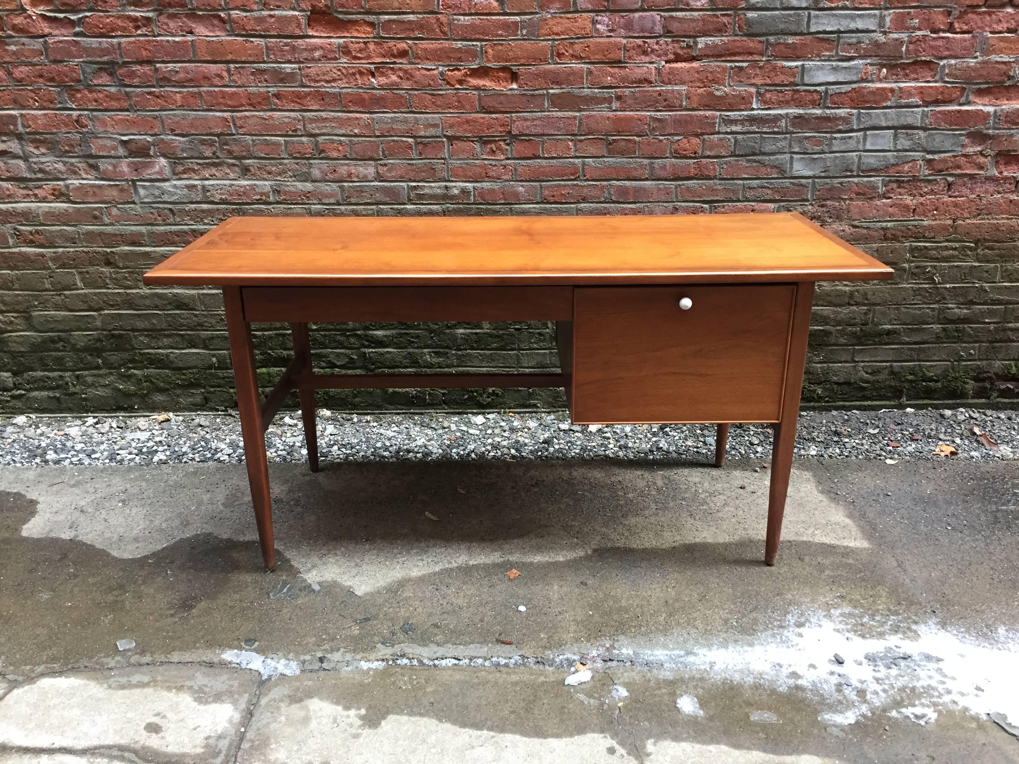 Beautifully refined design by Kipp Stewart for Drexel. One drawer for hanging files and the top drawer for all small desk items. Single porcelain knob and finished on all sides for use against a wall or in an open room format, circa 1960-1970.