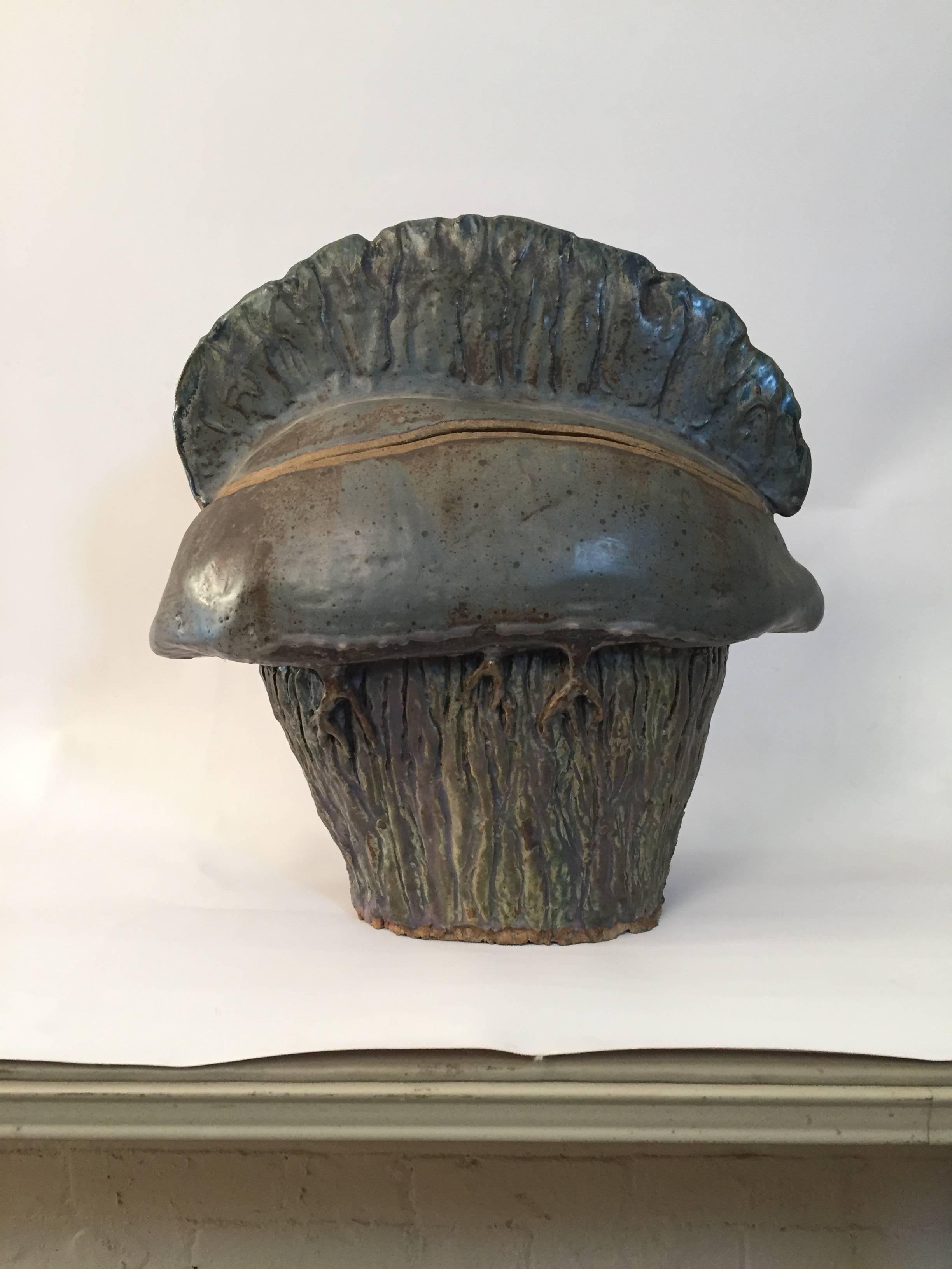 Executed by RISD potter, Laura Stanczyk, circa 1967-69. Heavy, thick walled slab constructed pottery vessel representing the venomous giant siphonophore, the Man O' War or Physalia physalis. Glazed in blue, brown and gray. Unsigned and purchased