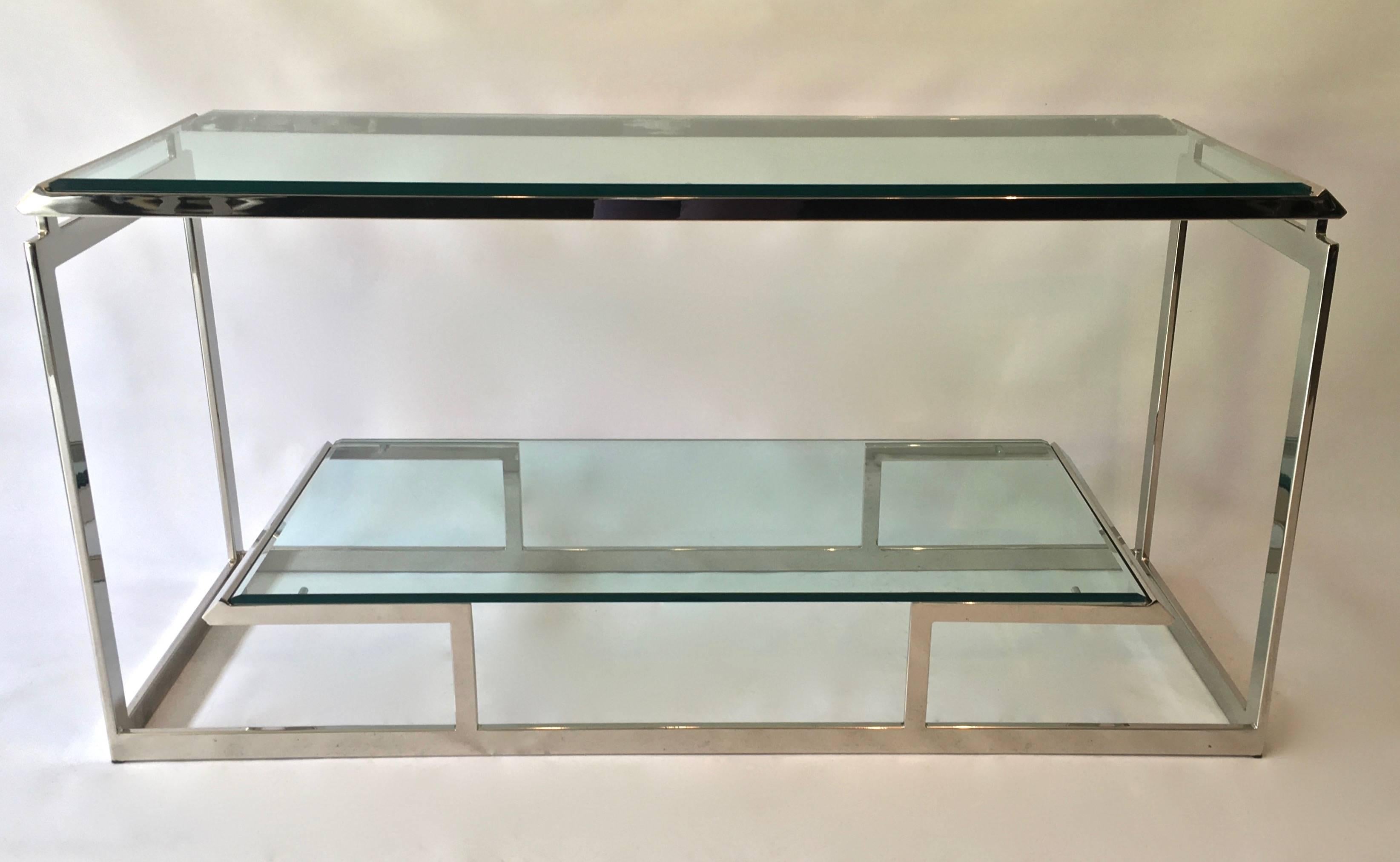 Chrome Mid Century Modern Console Table, newly professionally polished to perfection, this is a gorgeous geometric two level console table with 1/2 inch beveled glass shelving insets. Manner of Milo Baughman and Romeo Rega.