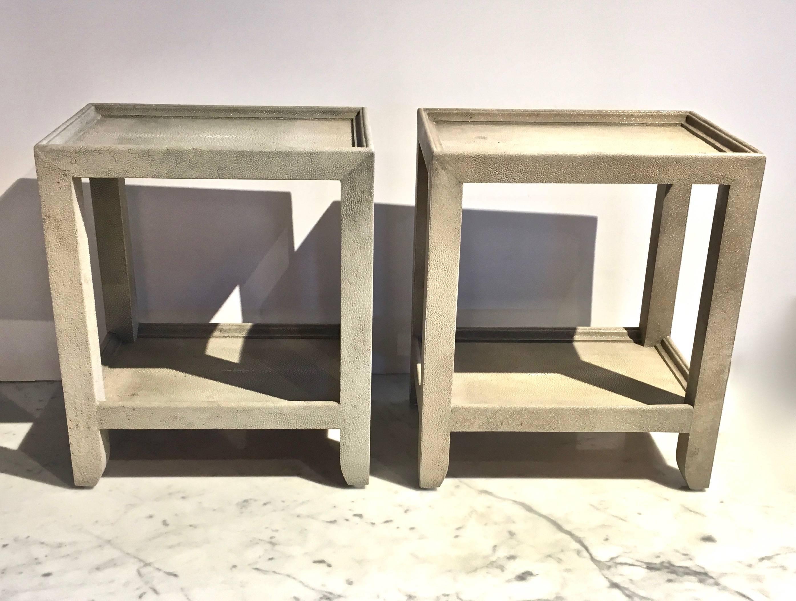 Pair of shagreen wrapped telephone side tables by Garrison Rousseau, a bespoke custom furniture maker specializing in exotic skins and woods, shagreen, parchment, straw marquetry. Tables have been used, with age appropriate wear and use, but present