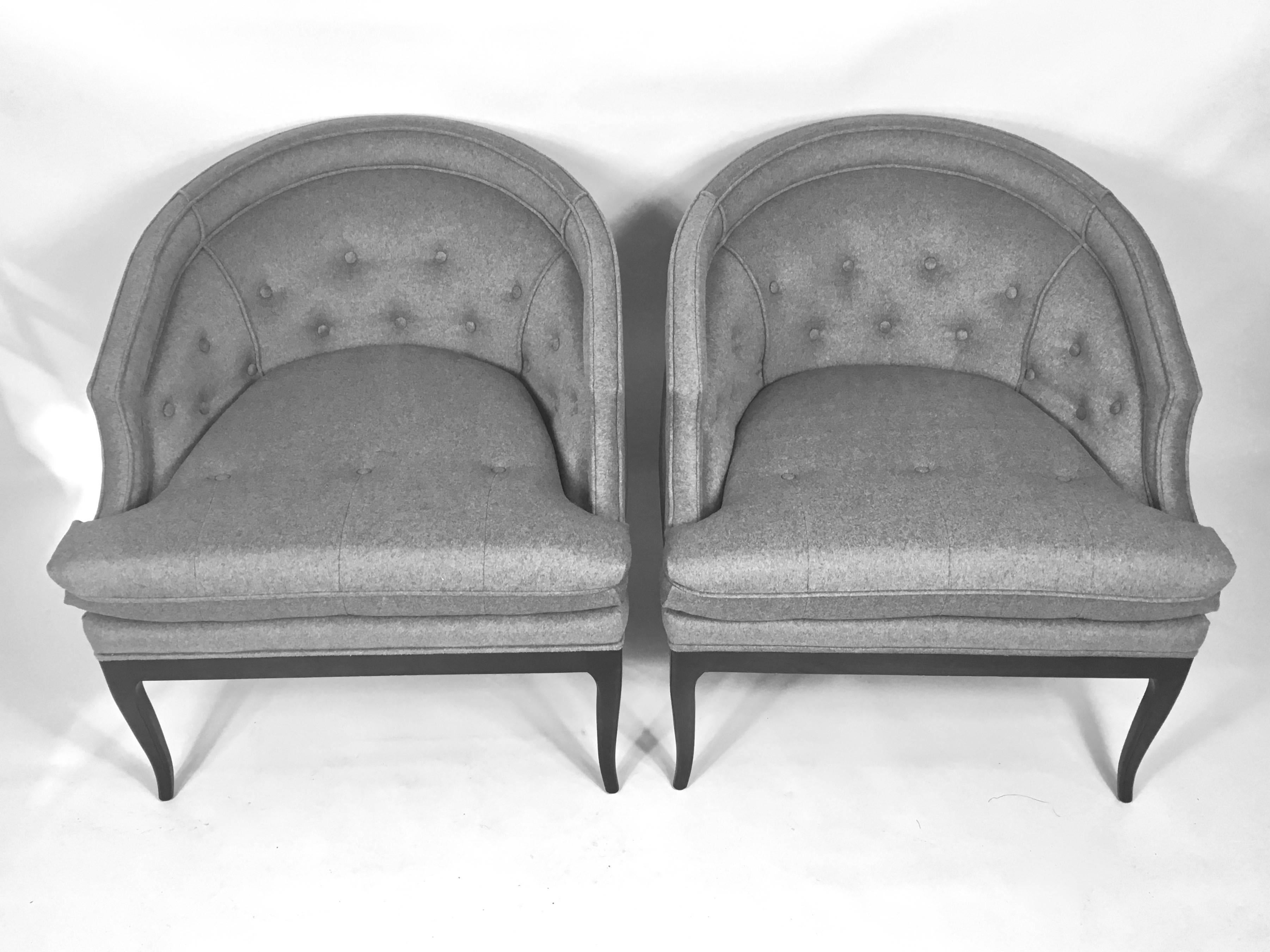 Rare labeled pair of Widdicomb, barrel back lounge or club chairs. Designed by Robsjohn Gibbings, the pair have a lovely dark chocolate walnut wood base ,with signature klismos style legs. The chairs newly re-upholstered, with new seat cushion,