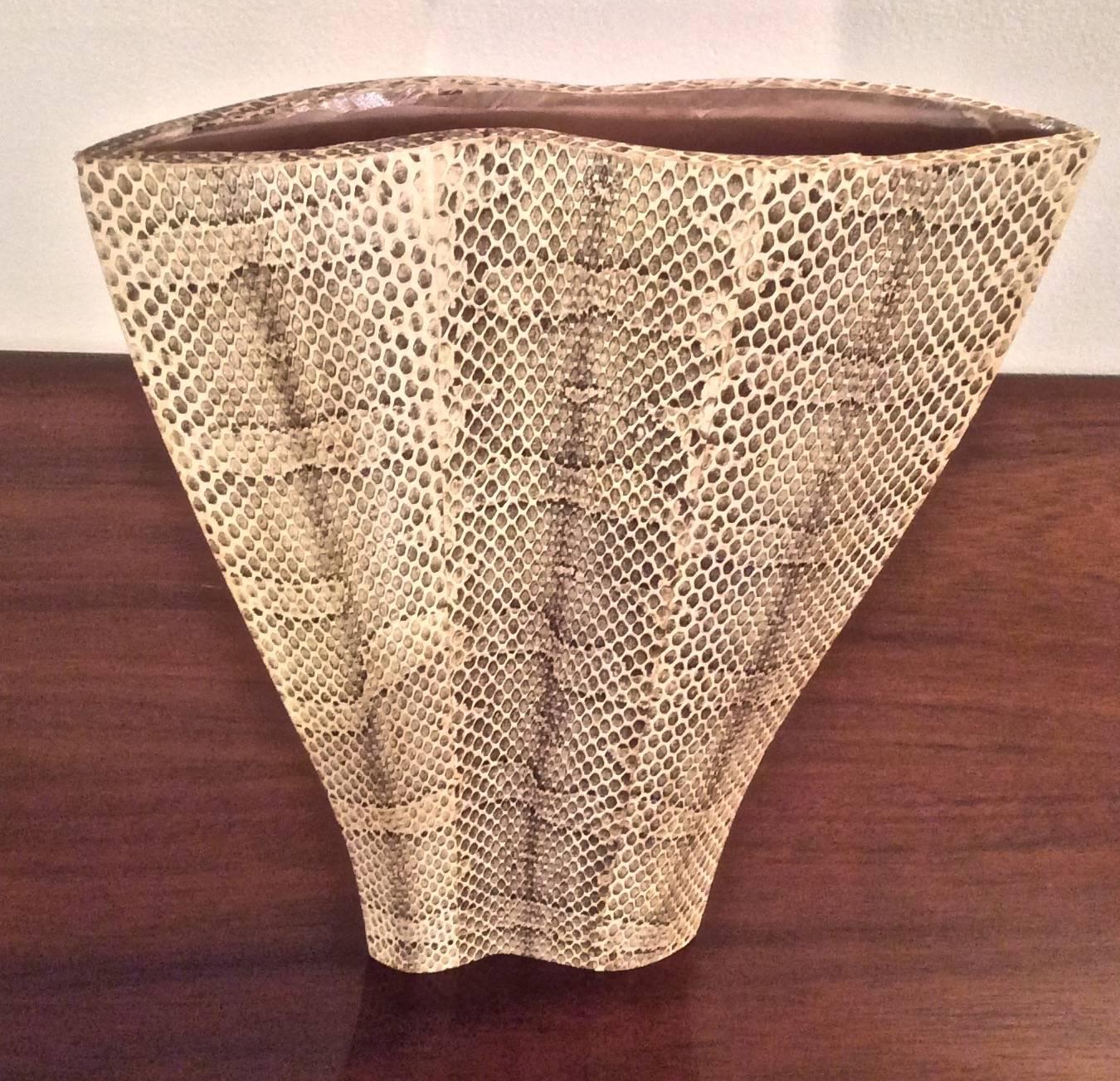 Subtle curved form for this sculptural one-of-a-kind vase sheathed in gorgeous snakeskin by famed decorative arts design firm R & Y Augousti.