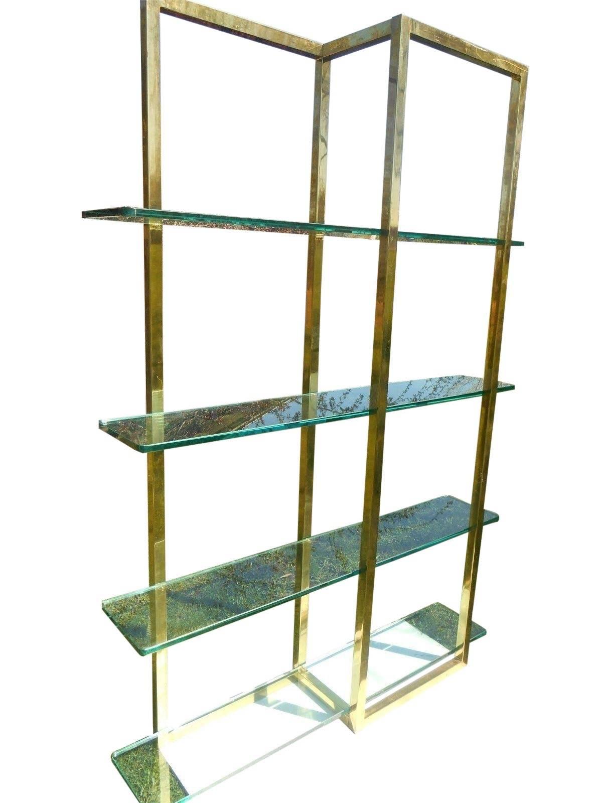 Gorgeous designer étagère from the 1970s. Quality 3/4 thick green glass shelves. Slim profile, finished on both sides and able to float in a room. 64