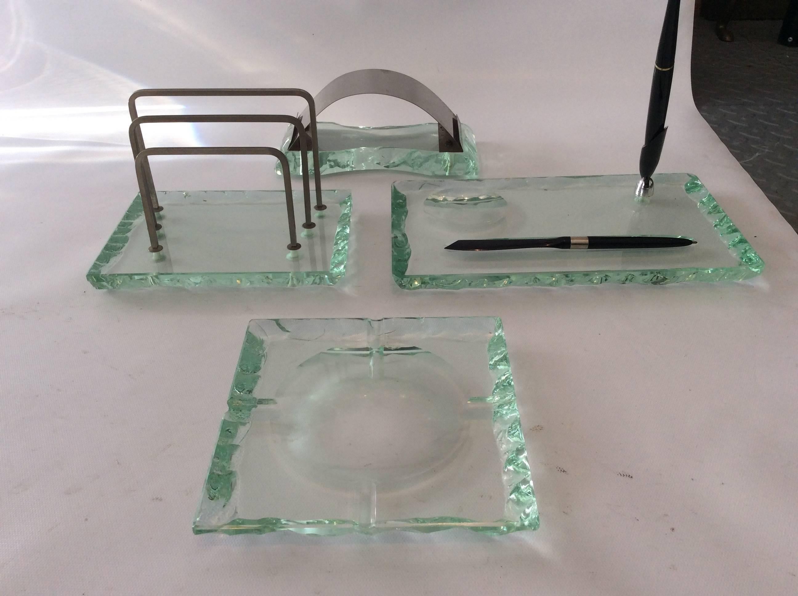Desk set produced by Fontana Arte, Italy 1950s. The set comprises a letter holder, pen holder, ashtray and blotter.