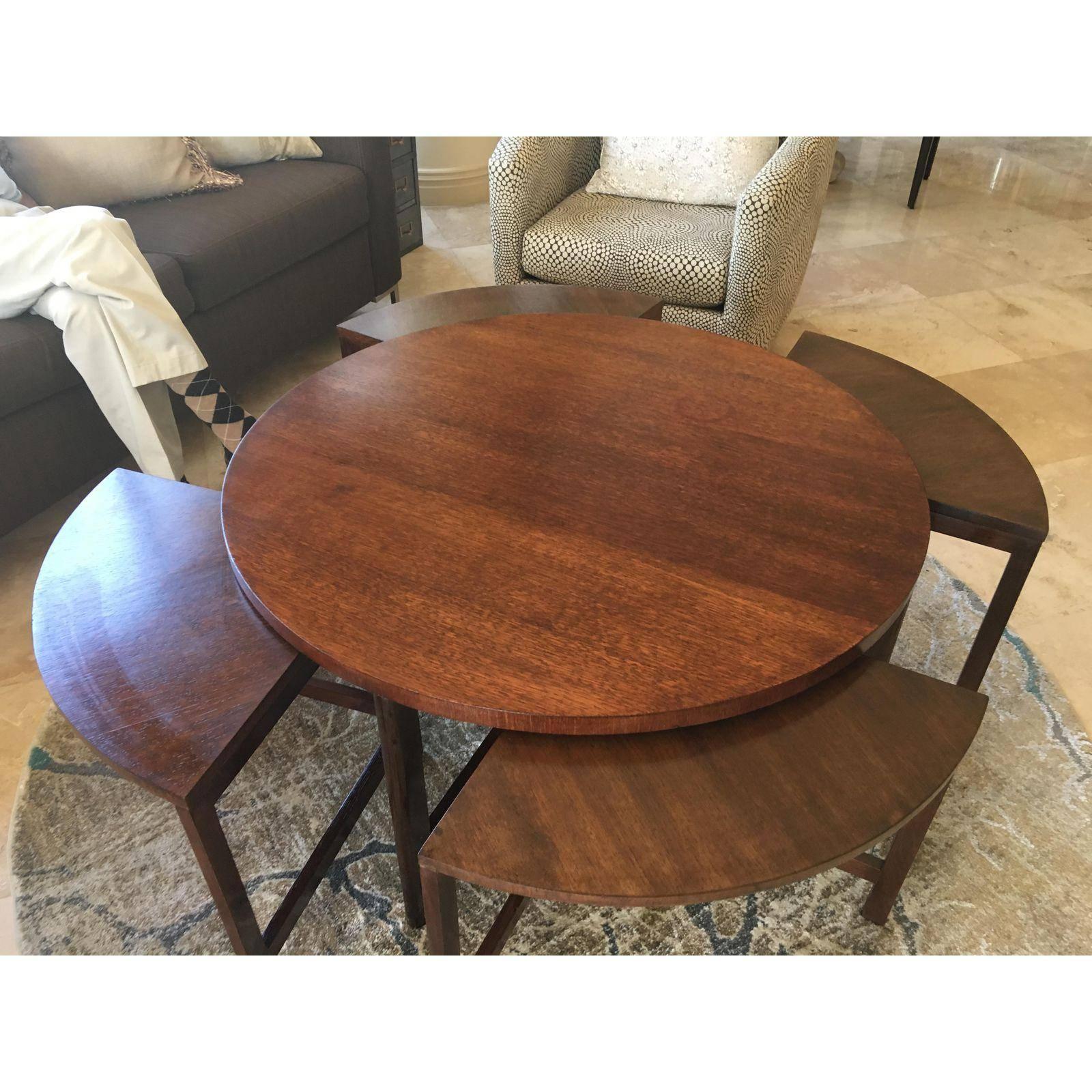 A really clever midcentury design, yields a round cocktail table and four additional triangular tables/benches nested underneath, for additional seating or table surface.
This is one of the pieces that is so useful, and good looking. Particularly