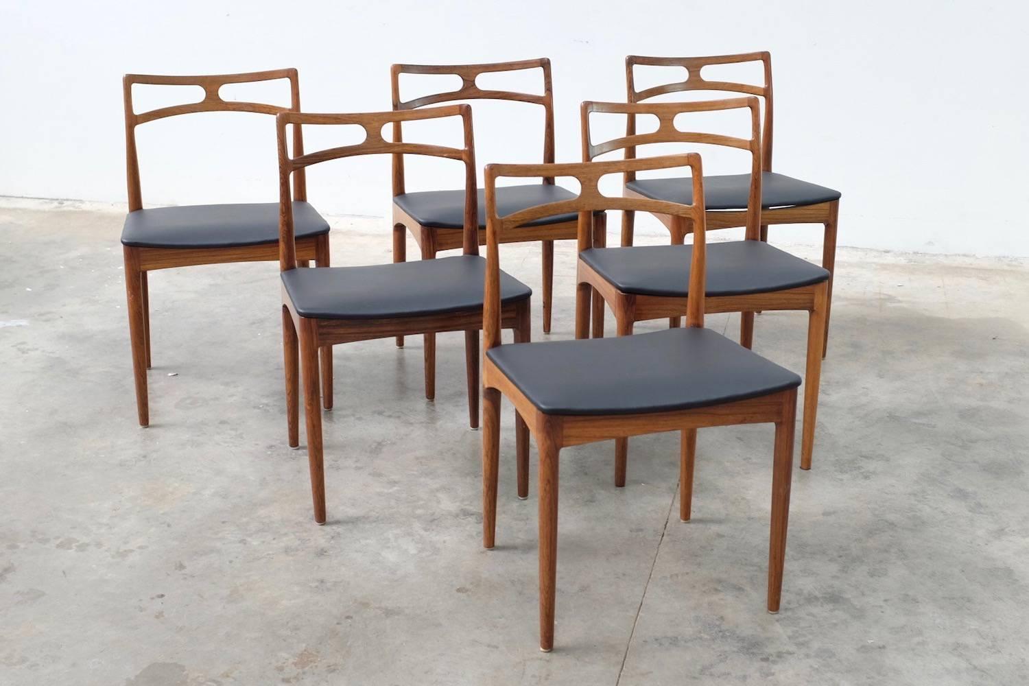 Set of six Johannes Andersen for Christian Lindeberg #94 dining chairs in rosewood.

Wonderful, Classic, sought after. These chairs are in original condition, never restored - just reupholstered in simple black leather. 

In excellent structural