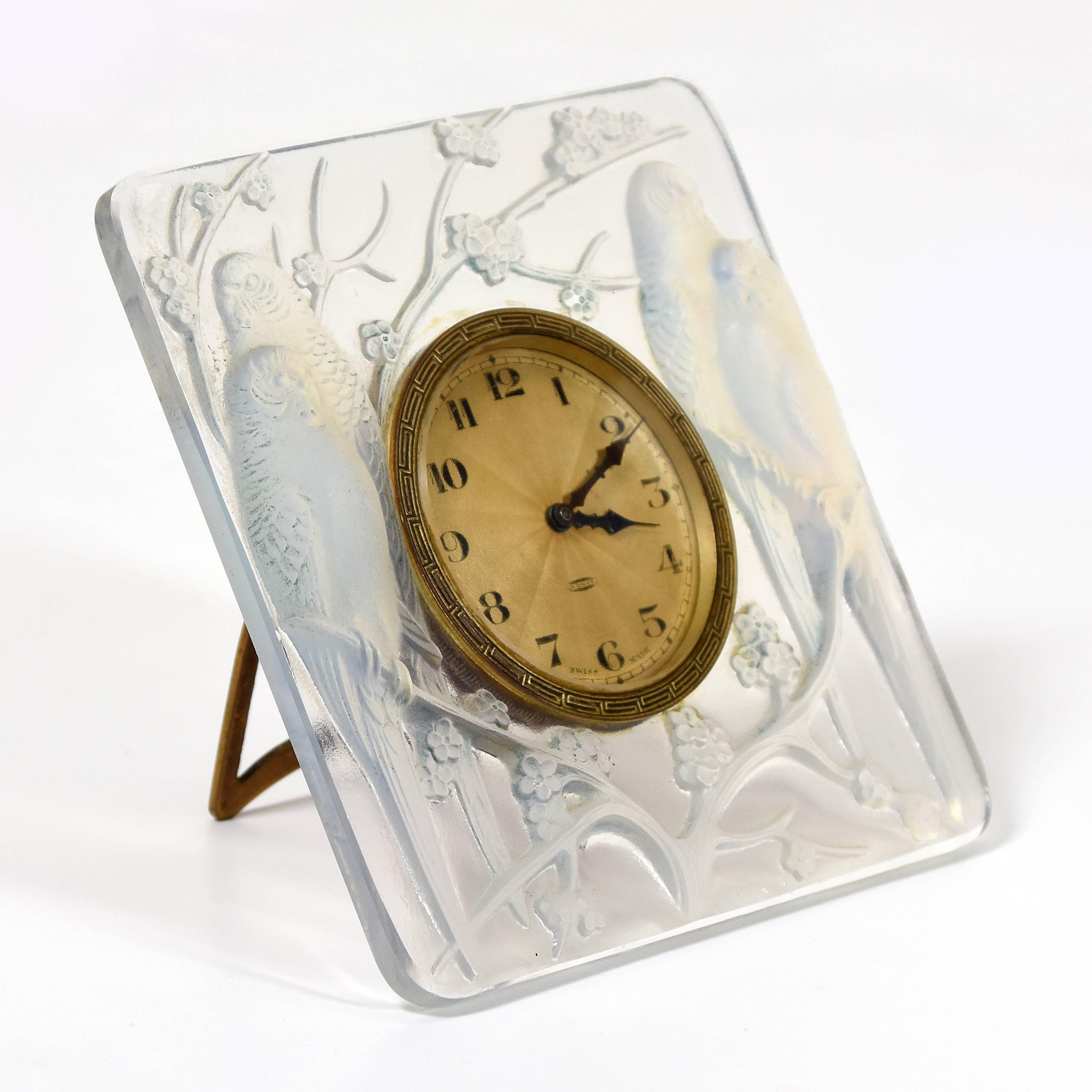 René Lalique (1860-1945)
'Inseperables Pendulette', circa 1926
Moulded clear and opalescent glass clock in working order
no. 765 designed in 1926
Measures: Height 11 cm, width 11 cm, depth 2 cm
moulded signature to the centre base of glass