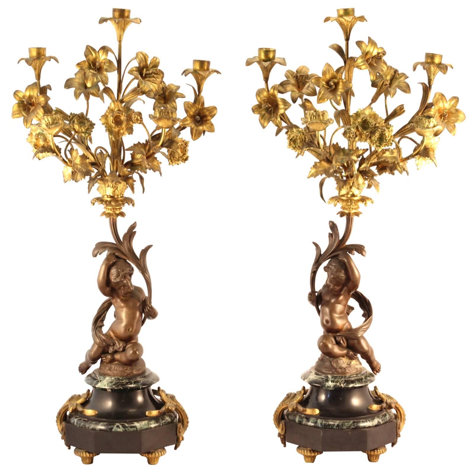 Pair of 19th Century Louis XVI Style Gilt and Cast Bronze Putti Candelabra For Sale