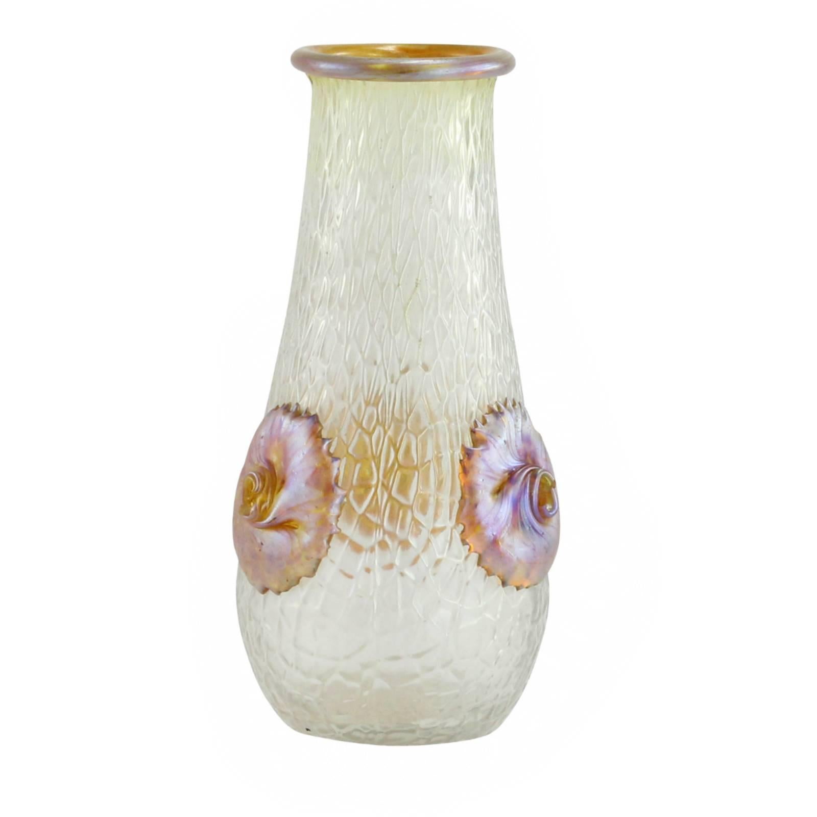 An early 20th century Bohemian glass vase, in the 'Nautilus' decor on a martele ground, by famed glass manufacturer Loetz.