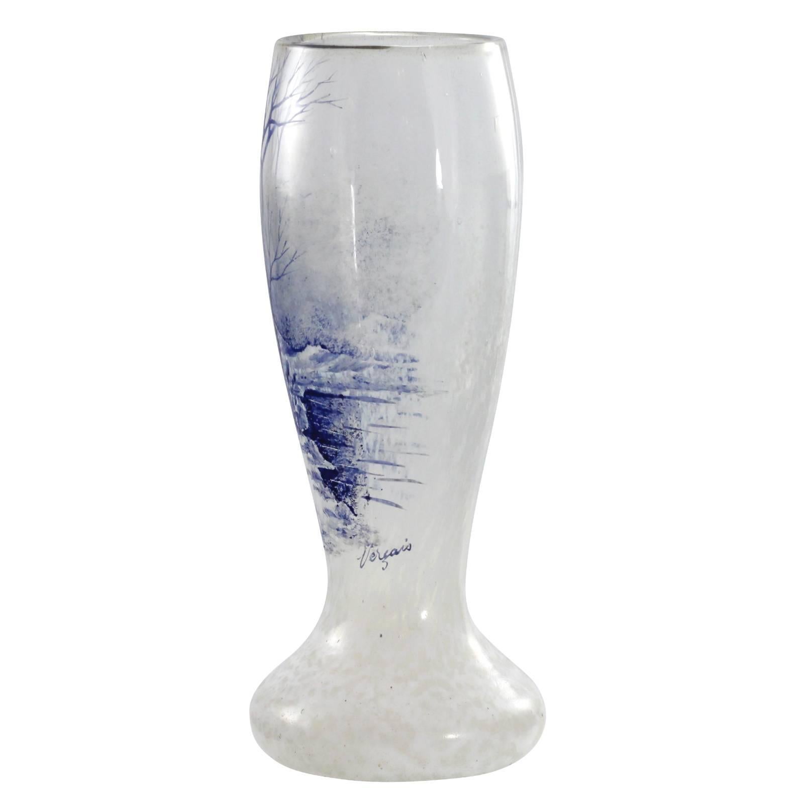 A white glass vase with a blue enamel landscape decoration from the Vercais range by Charles Schneider. The Vercais range was released in the 1930s, shortly after the crash of Wall Street, as a more affordable decorative domestic glass, compared to