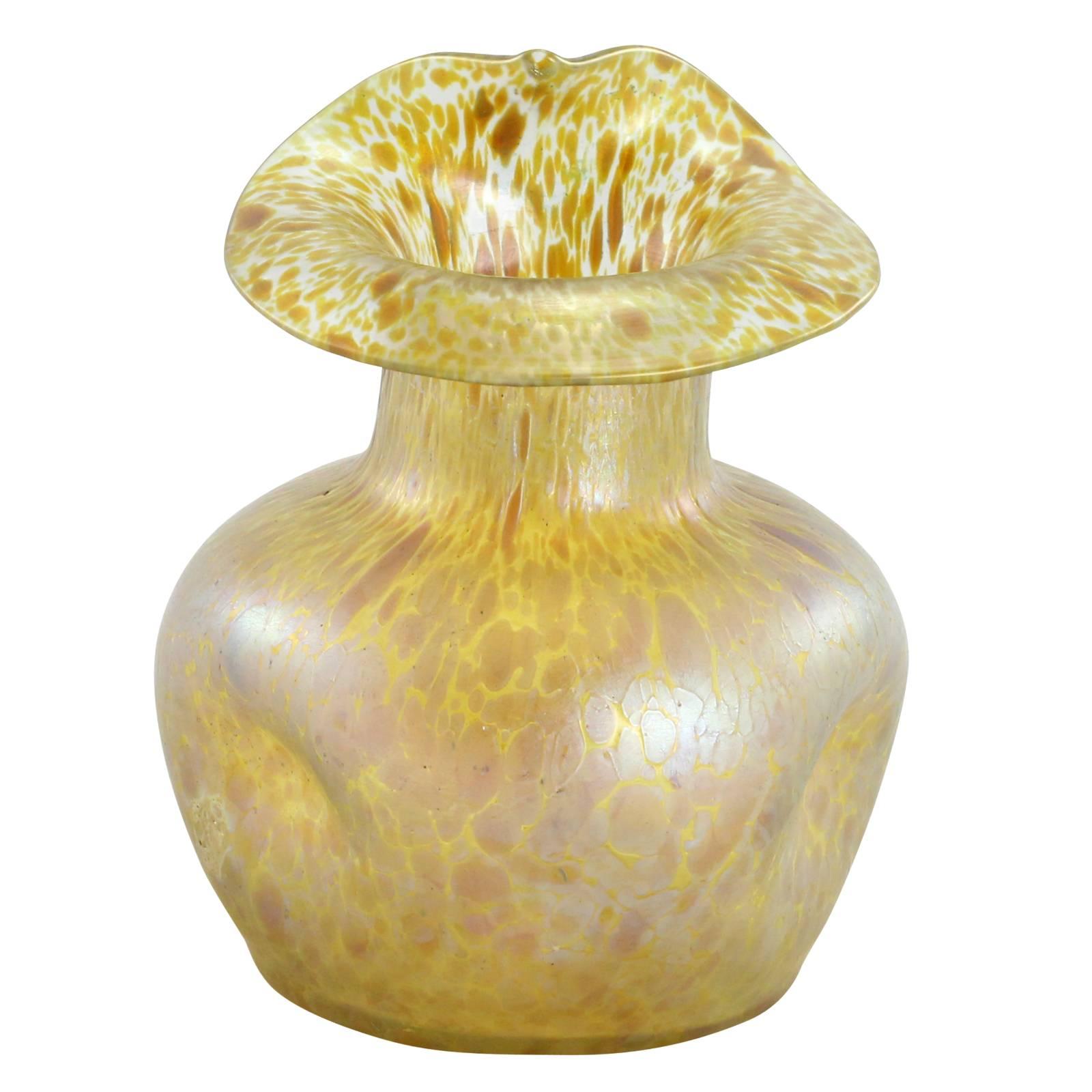 A late 19th century Art Nouveau glass vase in the 'Papillon' decor on a Candia ground, by Bohemian glassmakers Loetz. The piece features a 'jack-in-the-pulpit' style rim, with the body being dimpled on three sides.