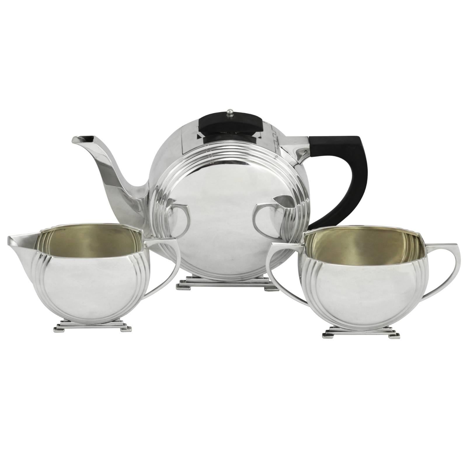 Early 20th Century Art Deco Sterling Silver Tea Set with Ebony Finial and Handle For Sale