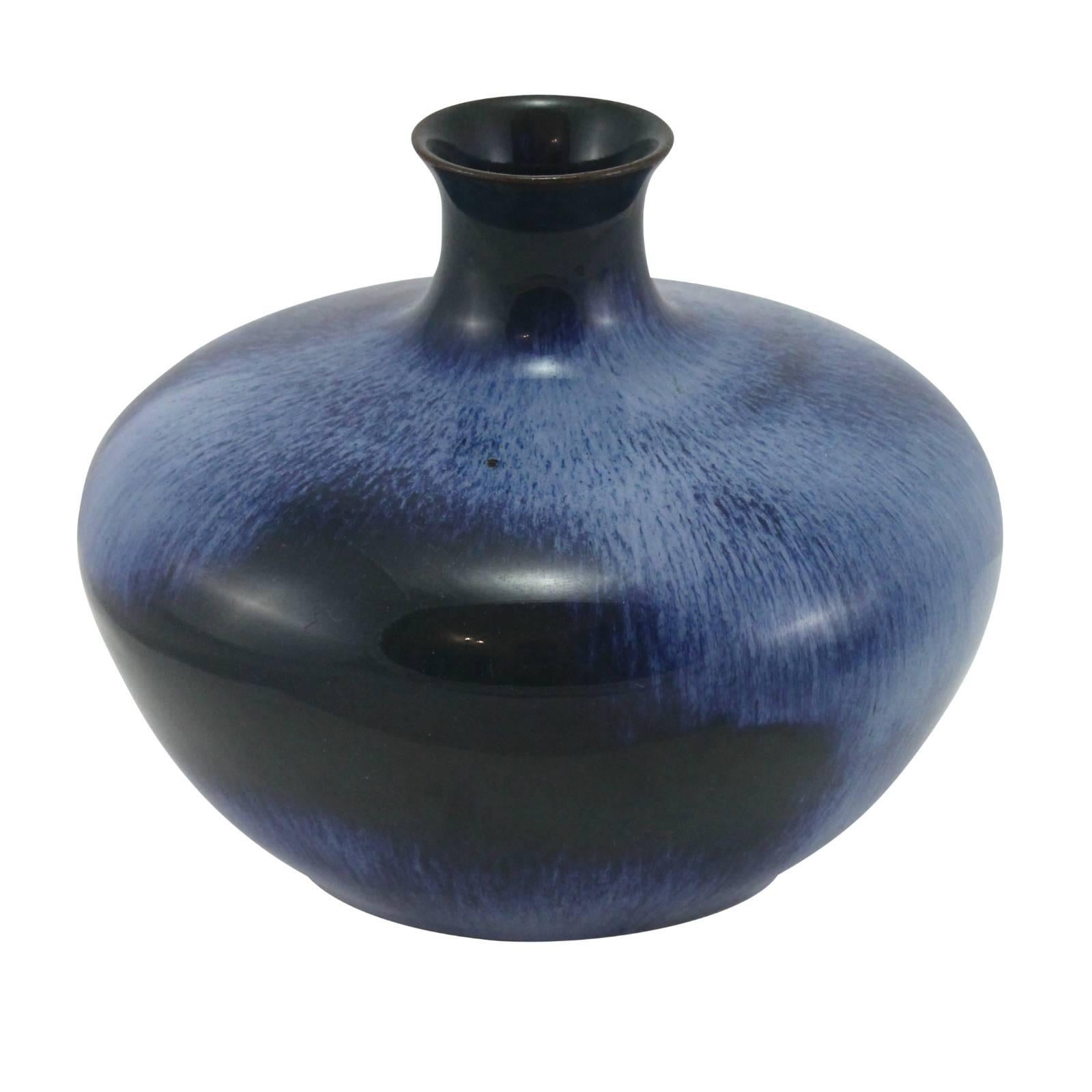 A blue and black glazed Arts and Crafts ceramic vase by the Ashby Potters Guild.