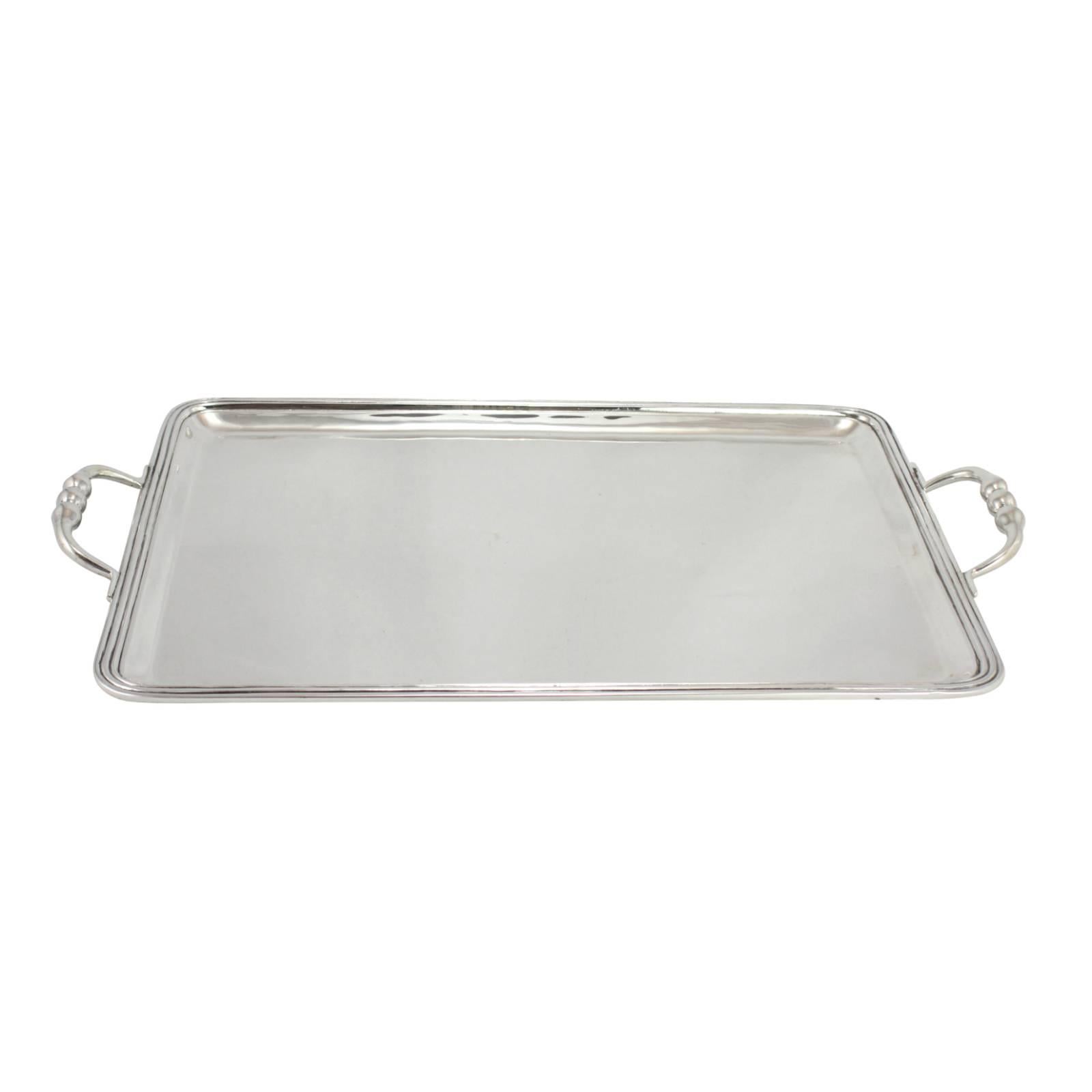 This piece is a midcentury, sterling silver serving tray by Sanborns, Mexico. 

When Frank Sanborn found a lack of quality silversmithing in Mexico in the 1920s, despite Mexico leading the world in silver production, he set out to bring a new