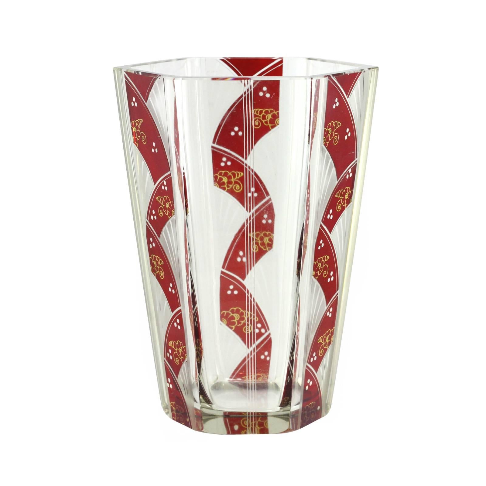 An early 20th century hexagonal Art Deco Bohemian glass vase by Karl Palda. Three sides of the vase are decorated with red and gold enameled panels, whilst the other three are subtly cut with four straight lines. Based in the Bohemian town of Novy