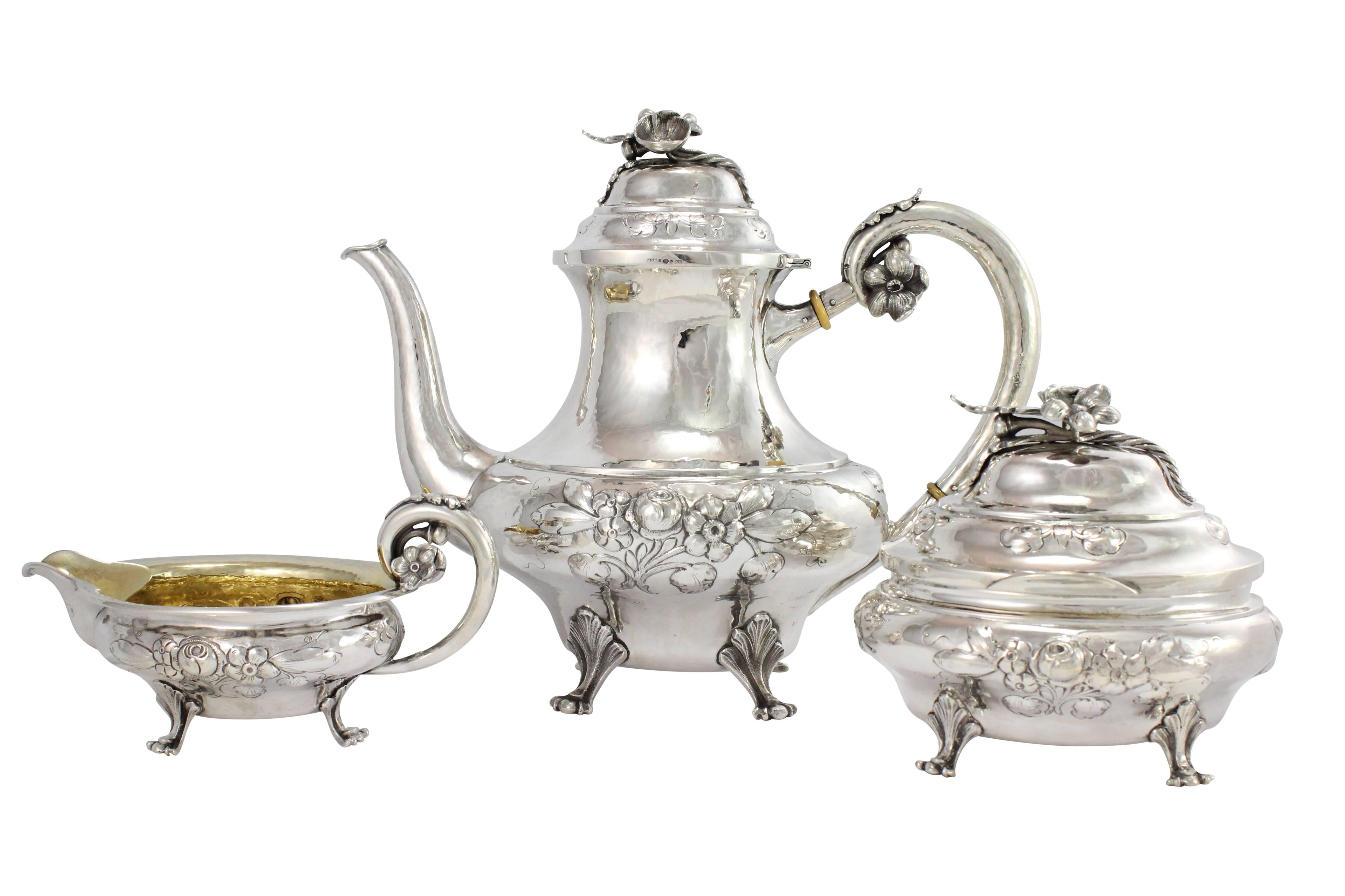 Originating from Skelleftea, Sweden in the 1930s this sterling silver coffee set by maker Svenska Guldsmedsbolaget H Jonsson, features a repousse motif on all three pieces. The set consists of a coffee pot, sugar bowl and creamer.

Measure: Pot: H