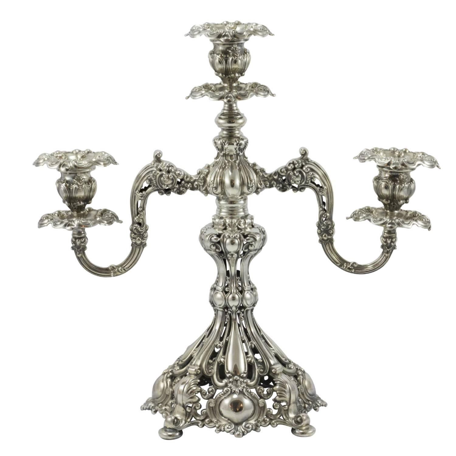 A pair of late 19th century silver plate three-arm candelabras in the Renaissance pattern by Reed and Barton.