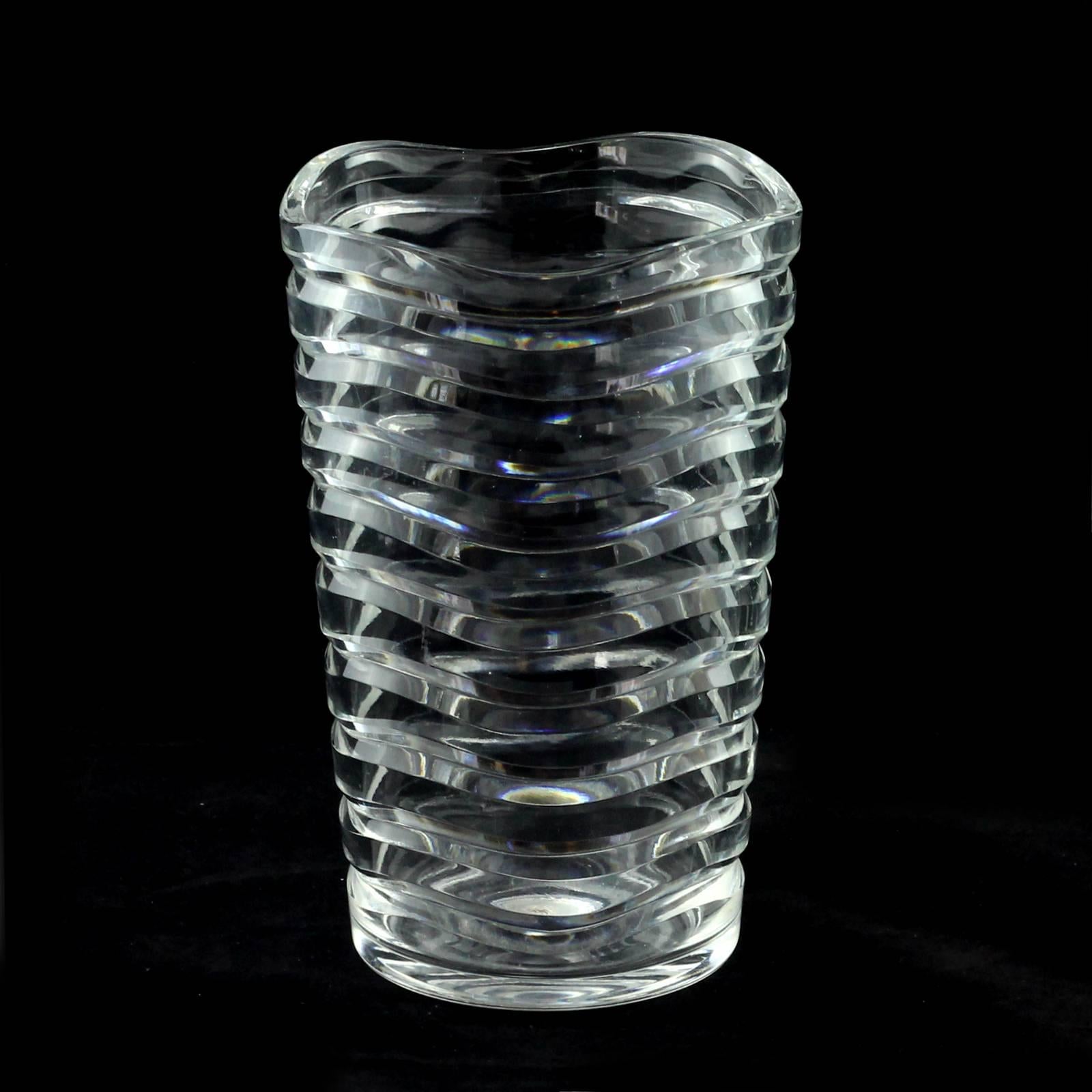 The design of this vase was the result of Keith Murray's time at the Royal Brierley glass company. Its form mimics the pattern of waves and creates a charming optical effect when filled with water.