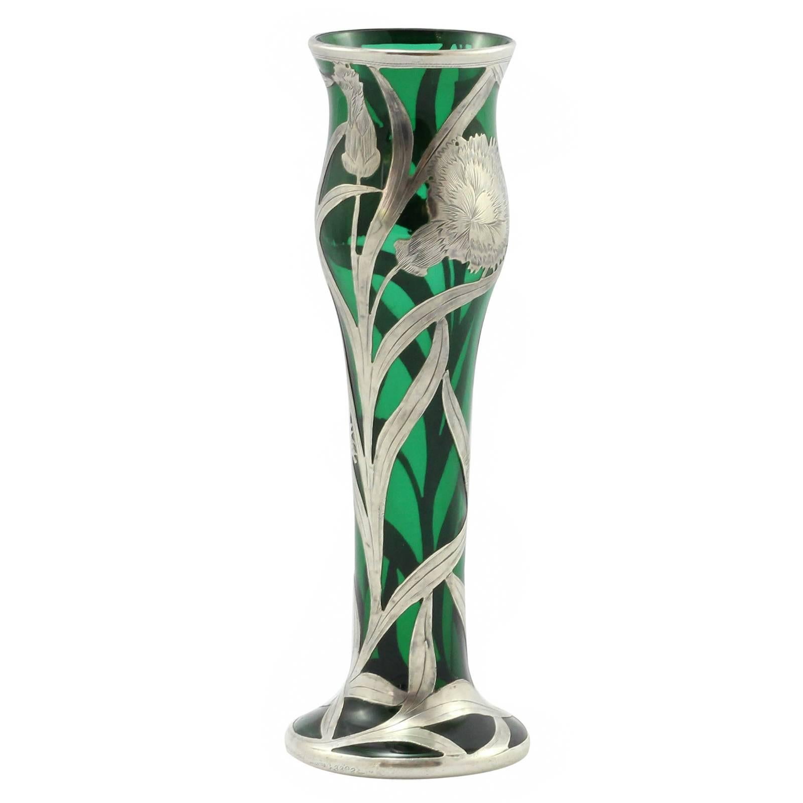 An Art Nouveau green glass vase with sterling silver overlay by Alvin Silver Manufacturing Company for Black, Starr, and Frost. 
