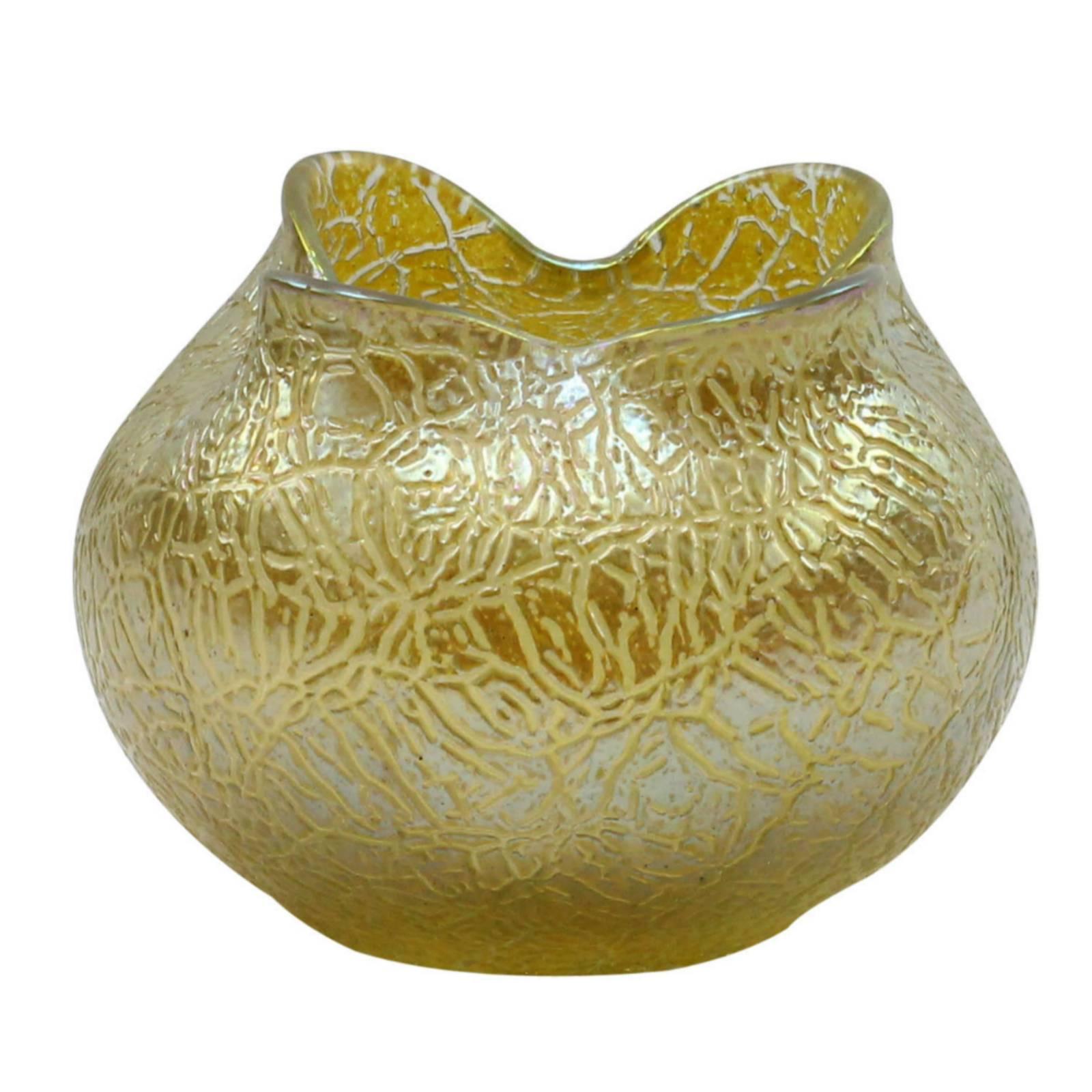 This iridescent honey-colored candia ground vase features the mimosa decor crackle glaze by famed Boehmian manufacturers Loetz Glass. This classic loetz shape features a quatrefoil lobed mouth and ground pontil mark to the base.