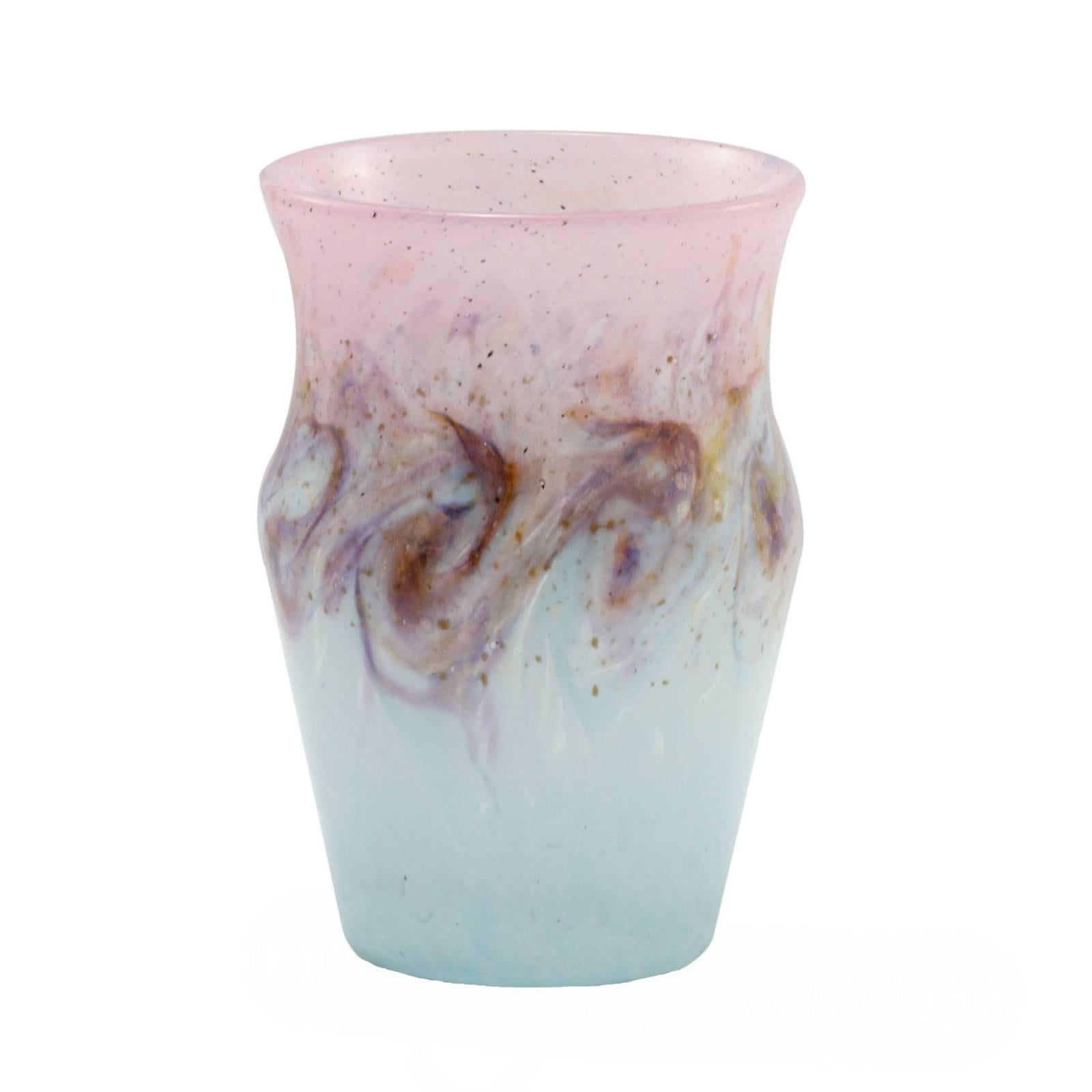 This vase by Monart was Scotland's answer to the art glass coming from France in the early 20th century. Crafted in the 1930s it was retailed by Liberty of London and features a rich palette of swirled pink and blue with metallic and iridescent