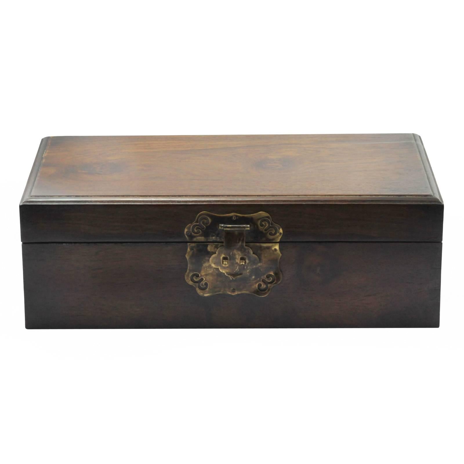 A late 19th century Qing Dynasty document box, made from solid huanghuali wood, with brass mounts and handles. 