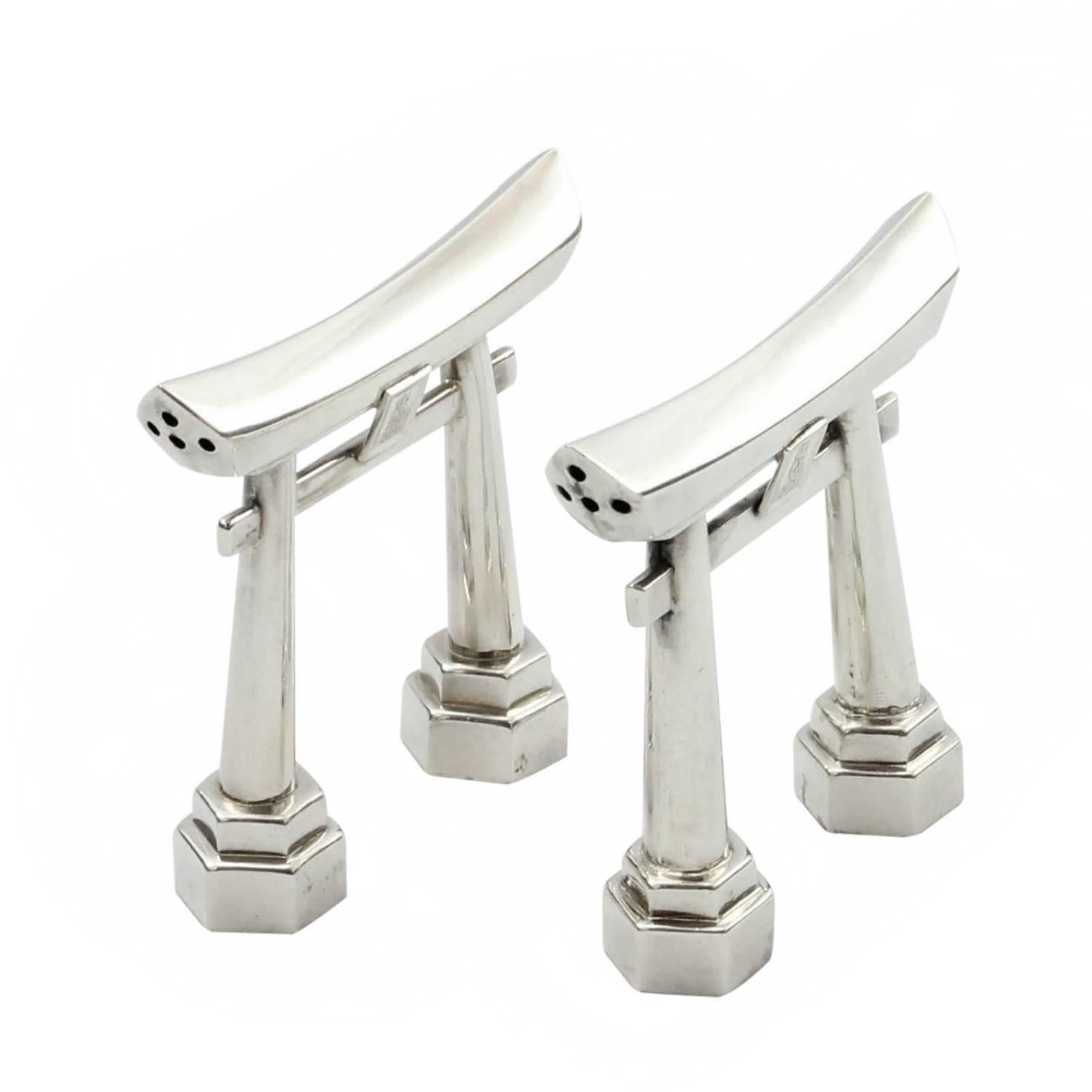 A pair of fine silver .970 purity salt and pepper shakers modeled as Japanese torii gates. Stamped Silver 970 to base. 

 