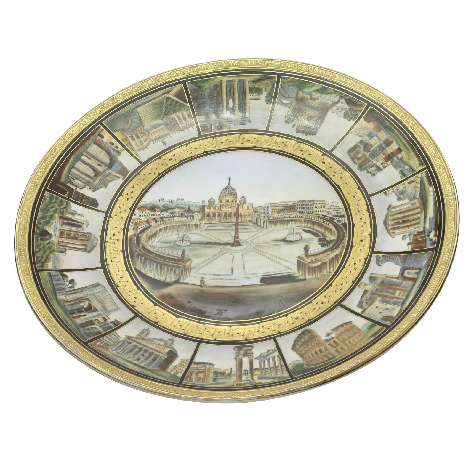 A 19th century Italian porcelain charger that has been hand-painted with popular Italian Grand Tour destinations and gold gilt decoration. Signed Verso, but artist is yet unidentified.