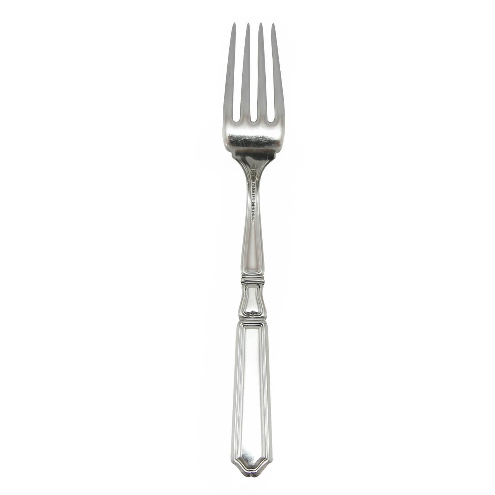 Named for the patron saint of silver and gold smiths. 

12 dinner knives, 12 dinner forks, 12 fish knives, three luncheon knives, ten butter knives, eight grapefruit spoons, eight ice cream spoon forks, one round serving spoon, one oval serving