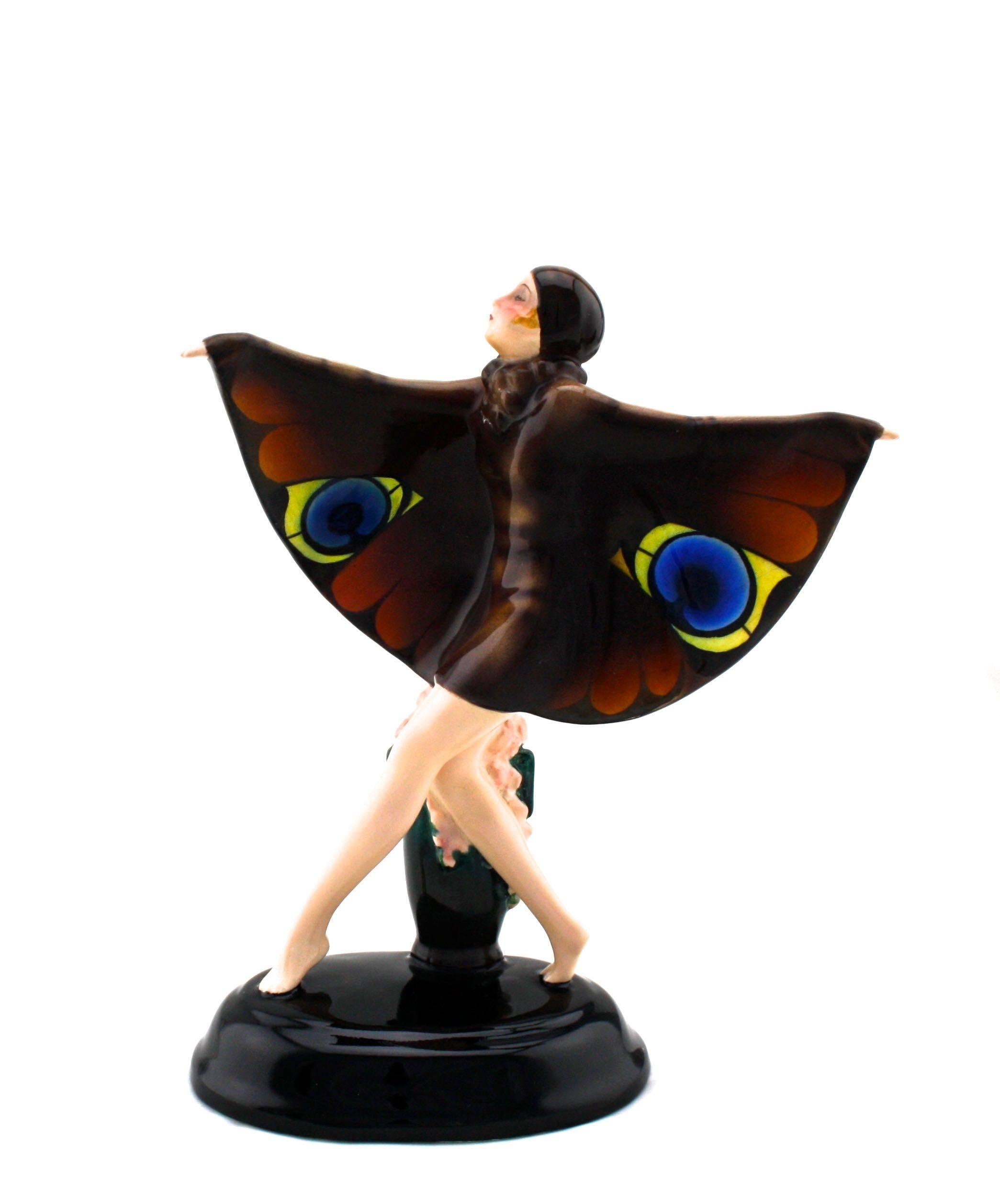 This little beauty is the smaller model and by far the rarest size and color version. Dressed to the nines in her butterfly cape.
She present is beautiful undamaged condition and would be the highlife of any serious Art Deco collection.
Crisp